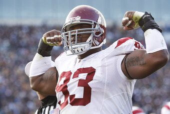 SOUTH BEND, IN - OCTOBER 17: Everson Griffen #93 of the USC Trojans celebrates after sacking Jimmy Clausen of the Notre Dame Fighting Irish at Notre Dame Stadium on October 17, 2009 in South Bend, Indiana. USC won 34-27. (Photo by Joe Robbins/Getty Images