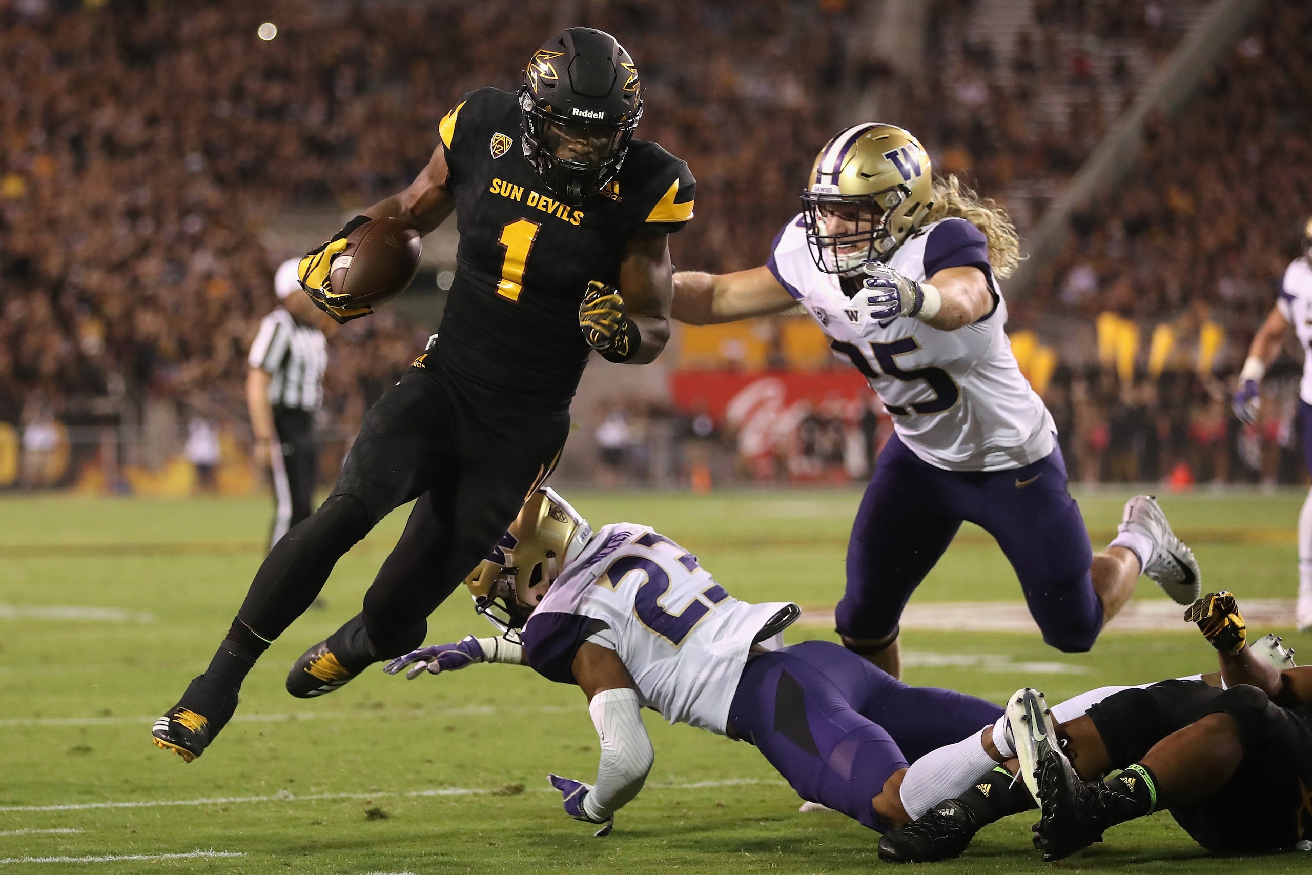 TEMPE, AZ - OCTOBER 14:  Wide receiver N'Keal Harry #1 of the Arizona State Sun Devils runs with the football after a reception past defensive back Jordan Miller #23 and linebacker Ben Burr-Kirven #25 of the Washington Huskies during the first half of the