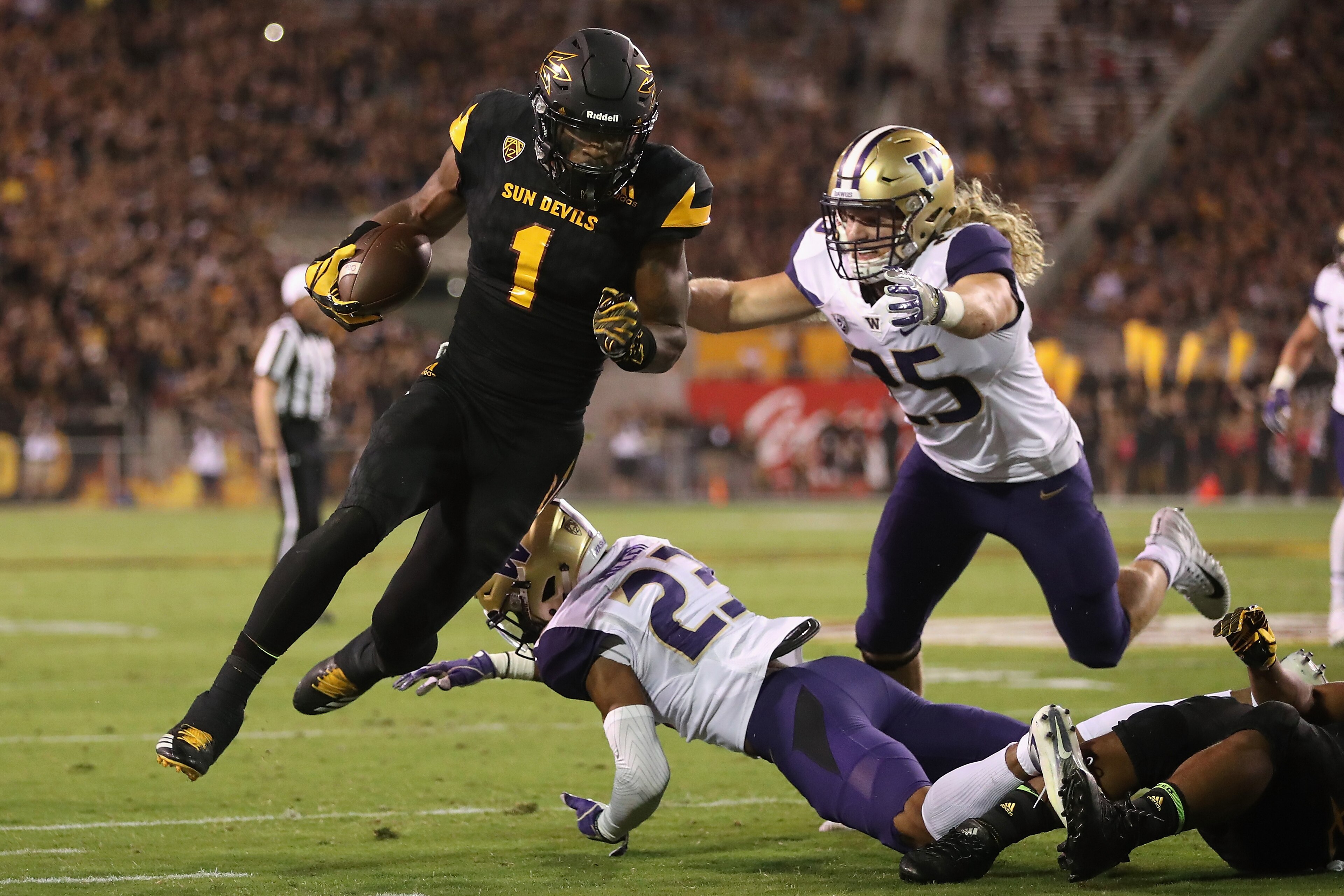 TEMPE, AZ - OCTOBER 14: Wide receiver N'Keal Harry #1 of the Arizona State Sun Devils runs with the football after a reception past defensive back Jordan Miller #23 and linebacker Ben Burr-Kirven #25 of the Washington Huskies during the first half of the TEMPE, AZ - OCTOBER 14: Wide receiver N'Keal Harry #1 of the Arizona State Sun Devils runs with the football after a reception past defensive back Jordan Miller #23 and linebacker Ben Burr-Kirven #25 of the Washington Huskies during the first half of the