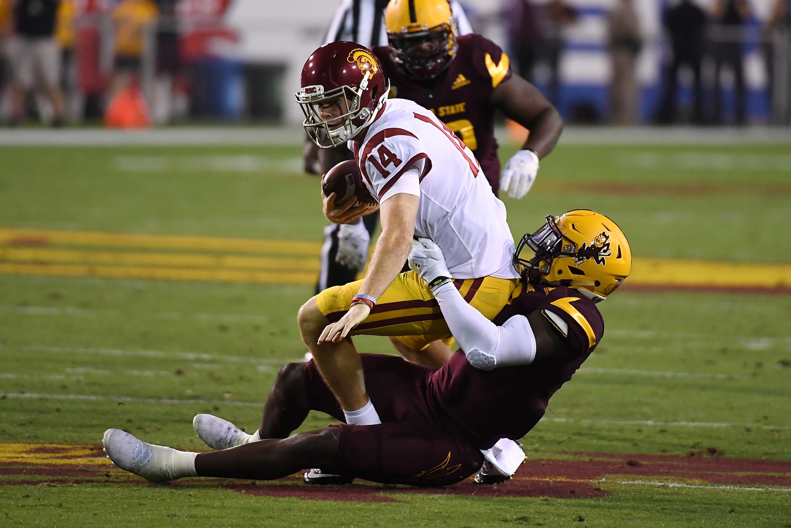 TEMPE, AZ - OCTOBER 28:  Sam Darnold #14 of Southern California is sacked by Christian Sam #2 of Arizona State during the first half at Sun Devil Stadium on October 28, 2017 in Tempe, Arizona.  (Photo by Norm Hall/Getty Images)