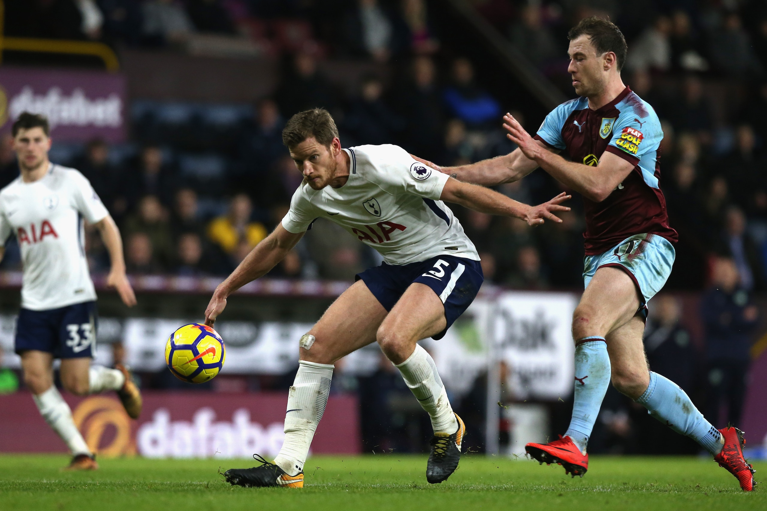 BURNLEY, ENGLAND - DECEMBER 23:  Jan Vertonghen of Tottenham Hotspur is closed down by Phil Bardsley during the Premier League match between Burnley and Tottenham Hotspur at Turf Moor on December 23, 2017 in Burnley, England.  (Photo by Nigel Roddis/Getty