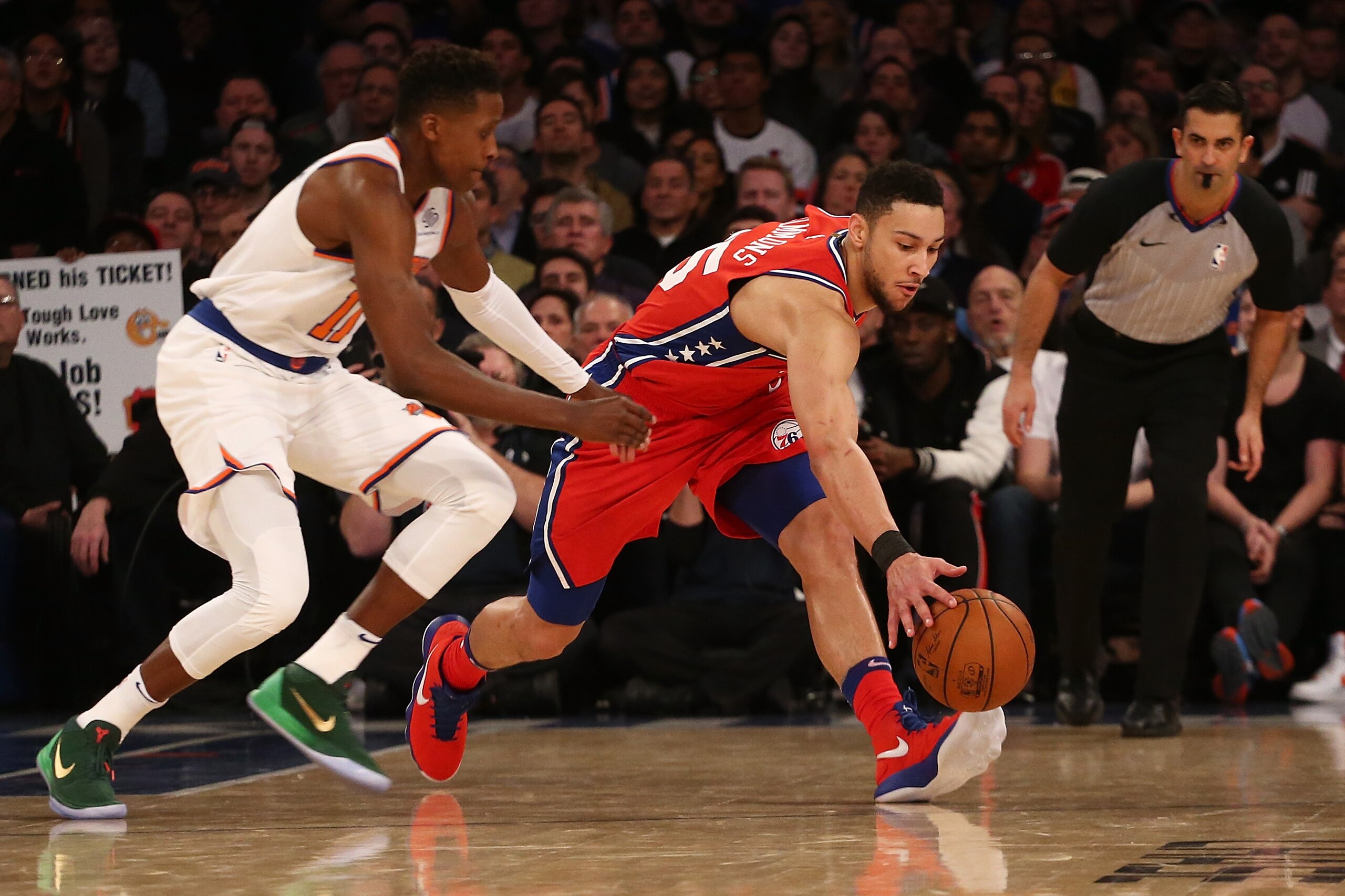 NEW YORK, NY - DECEMBER 25:  Ben Simmons #25 of the Philadelphia 76ers and Frank Ntilikina #11 of the New York Knicks scramble for the loose ball at Madison Square Garden on December 25, 2017 in New York City.  (Photo by Mike Stobe/Getty Images)