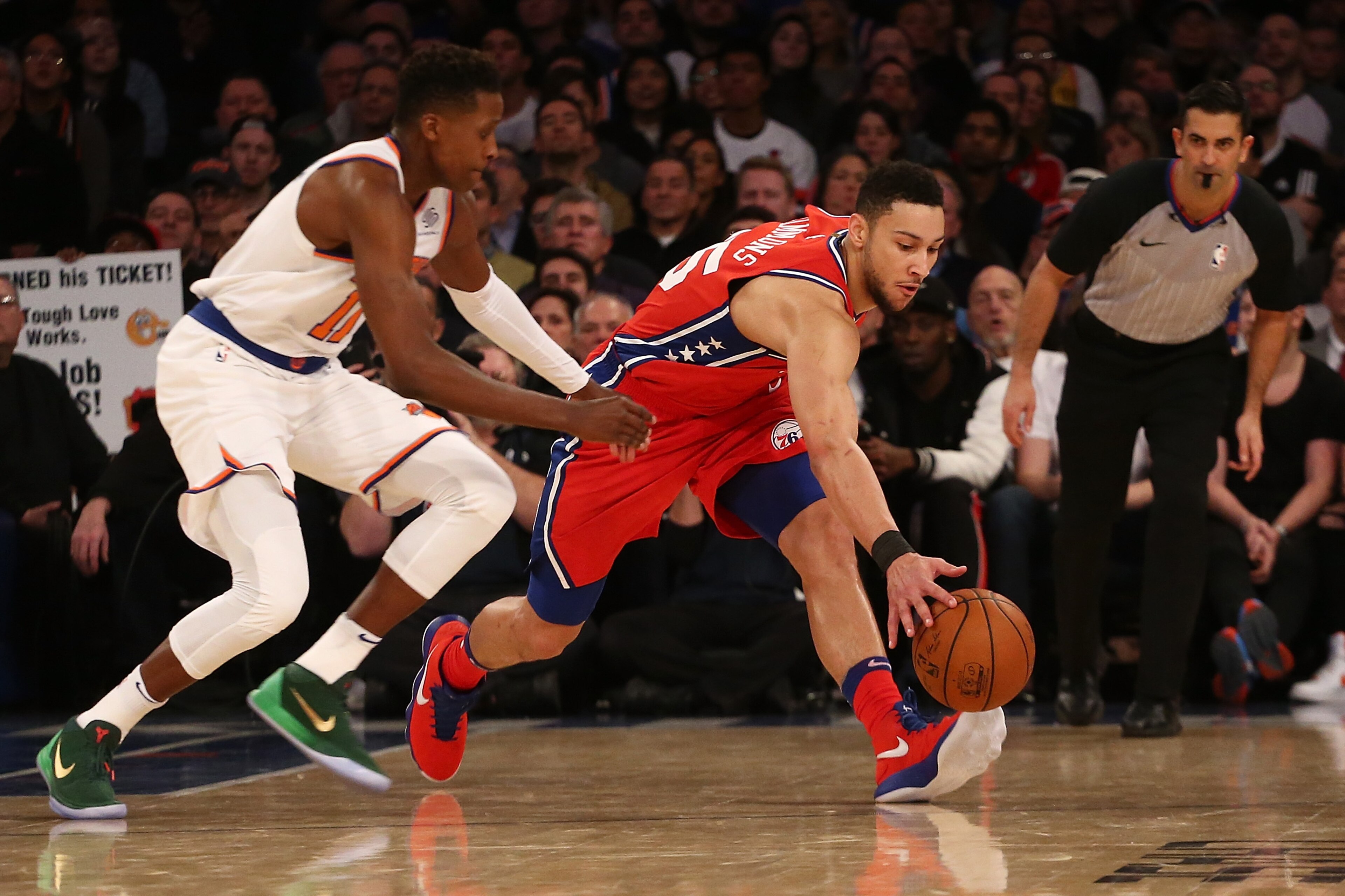 NEW YORK, NY - DECEMBER 25:  Ben Simmons #25 of the Philadelphia 76ers and Frank Ntilikina #11 of the New York Knicks scramble for the loose ball at Madison Square Garden on December 25, 2017 in New York City.  (Photo by Mike Stobe/Getty Images)