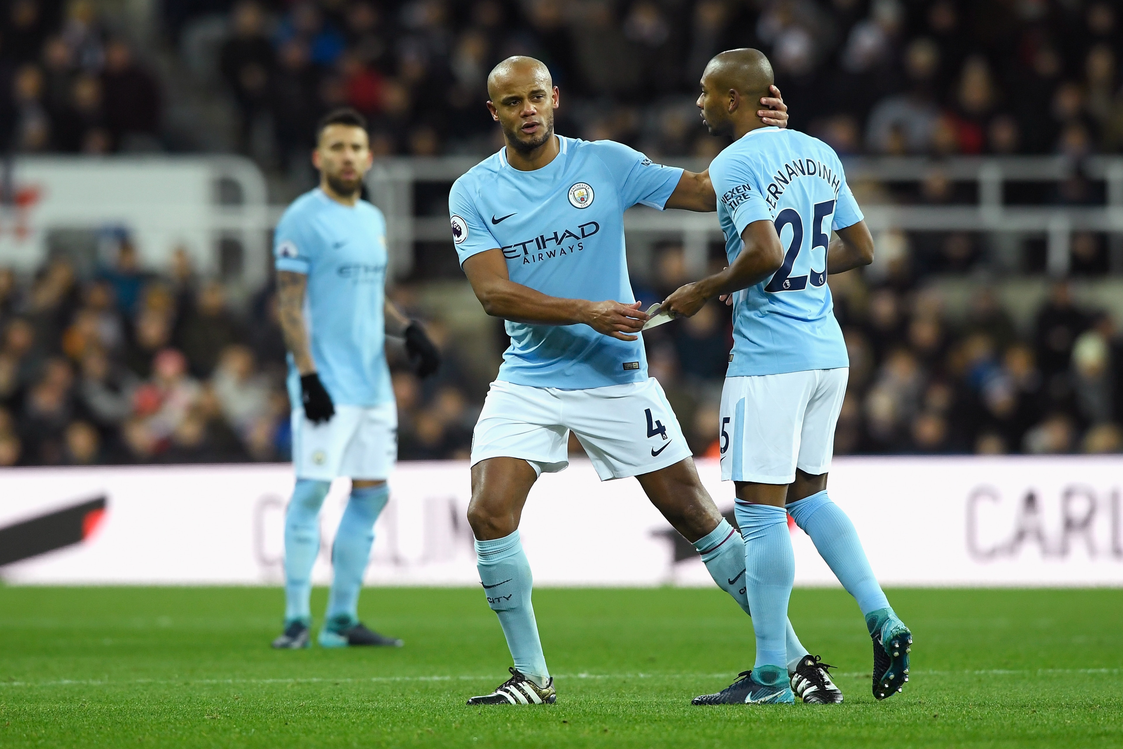 NEWCASTLE UPON TYNE, ENGLAND - DECEMBER 27: Vincent Kompany of Manchester City gives his captain's armband to Fernandinho of Manchester City as he goes off injured during the Premier League match between Newcastle United and Manchester City at St. James' NEWCASTLE UPON TYNE, ENGLAND - DECEMBER 27: Vincent Kompany of Manchester City gives his captain's armband to Fernandinho of Manchester City as he goes off injured during the Premier League match between Newcastle United and Manchester City at St. James'