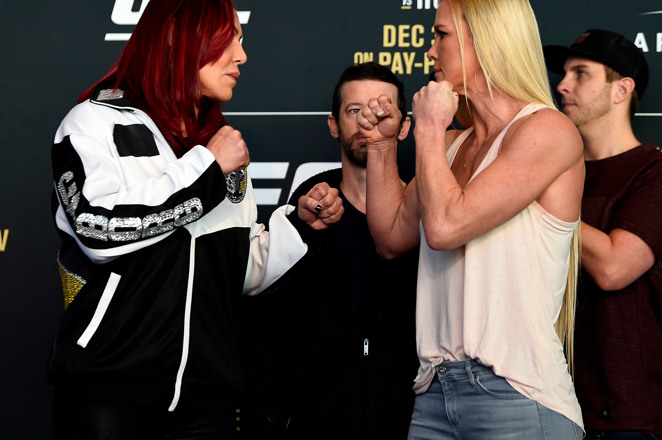 LAS VEGAS, NV - DECEMBER 28:  (L-R) UFC women's featherweight champion Cris Cyborg of Brazil and challenger Holly Holm face off for the media during the UFC 219 Ultimate Media Day inside T-Mobile Arena on December 28, 2017 in Las Vegas, Nevada. (Photo by 
