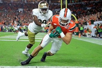 MIAMI GARDENS, FL - NOVEMBER 11:  Braxton Berrios #8 of the Miami Hurricanes scores a touchdown during a game against the Notre Dame Fighting Irish at Hard Rock Stadium on November 11, 2017 in Miami Gardens, Florida.  (Photo by Mike Ehrmann/Getty Images)