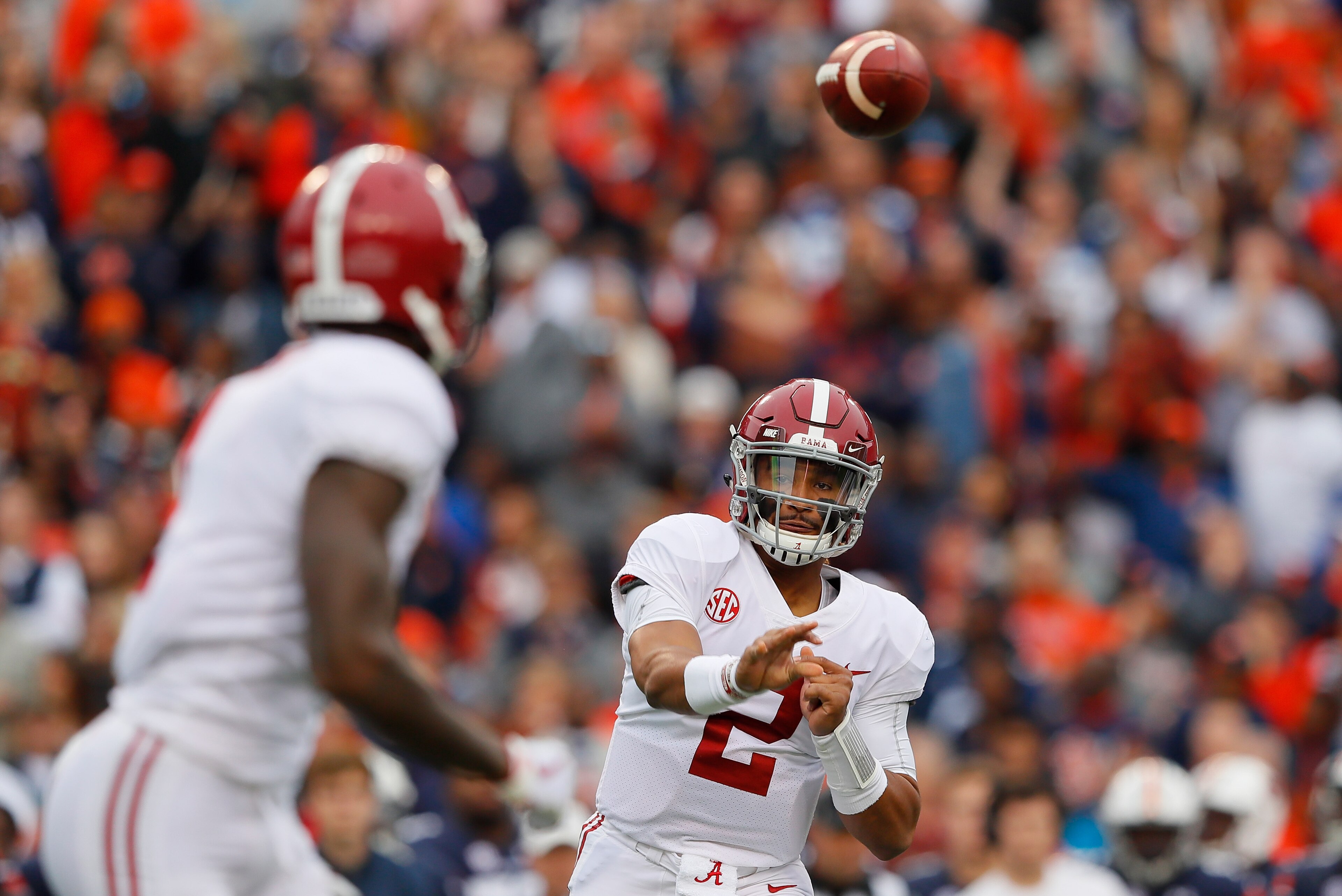 AUBURN, AL - NOVEMBER 25:  Jalen Hurts #2 throws a pass to Robert Foster #1 of the Alabama Crimson Tide during the first quarter against the Auburn Tigers at Jordan Hare Stadium on November 25, 2017 in Auburn, Alabama.  (Photo by Kevin C. Cox/Getty Images