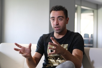 Spanish footballer Xavi Hernandez, who currently plays for the Qatari football club Al-Sadd, speaks to journalists during a tour of the Khalifa International Stadium in Doha on May 18, 2017, after it was refurbished ahead of the Qatar 2022 FIFA World Cup.