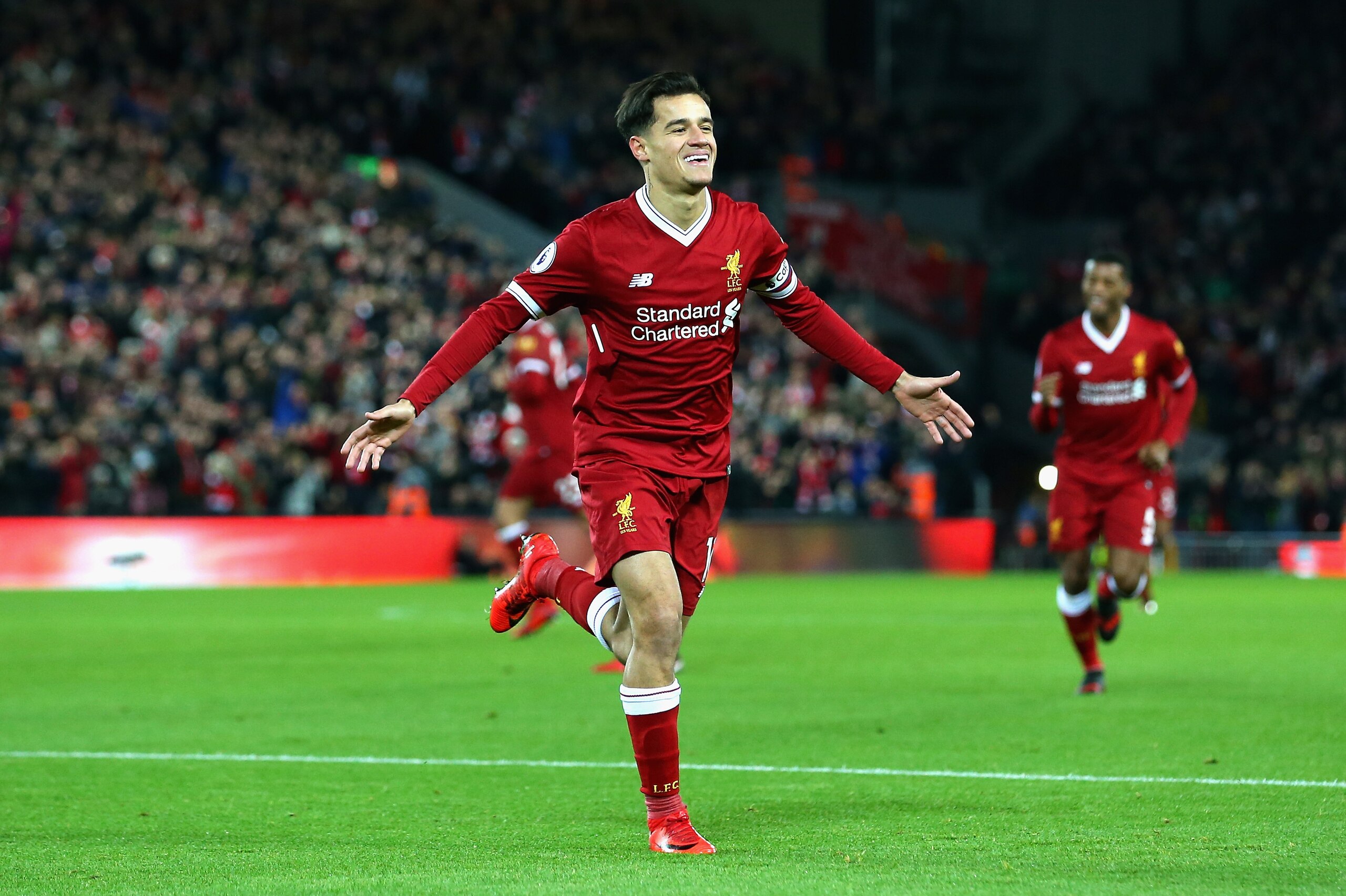 LIVERPOOL, ENGLAND - DECEMBER 26:  Philippe Coutinho of Liverpool scores his sides first goal during the Premier League match between Liverpool and Swansea City at Anfield on December 26, 2017 in Liverpool, England.  (Photo by Jan Kruger/Getty Images)
