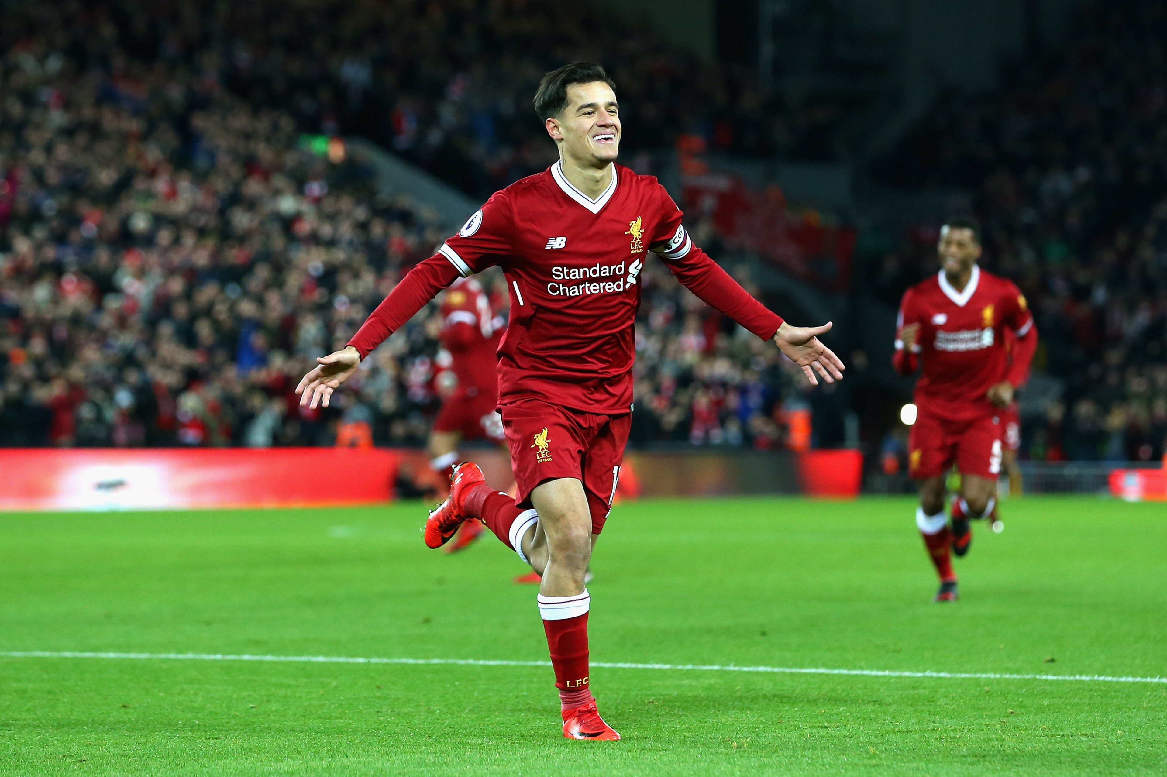 LIVERPOOL, ENGLAND - DECEMBER 26:  Philippe Coutinho of Liverpool scores his sides first goal during the Premier League match between Liverpool and Swansea City at Anfield on December 26, 2017 in Liverpool, England.  (Photo by Jan Kruger/Getty Images)