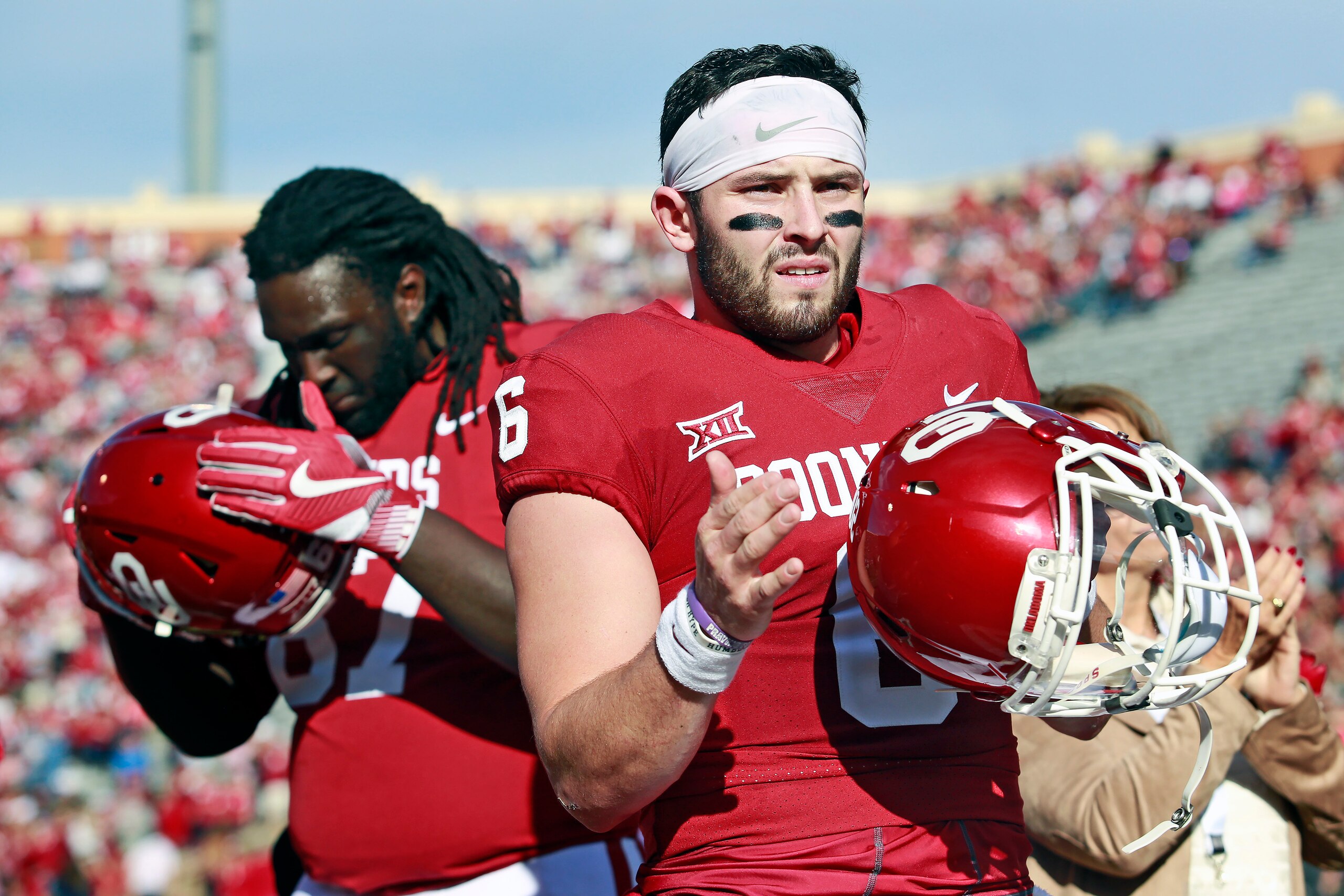 NORMAN, OK - NOVEMBER 25: Quarterback Baker Mayfield #6 of the Oklahoma Sooners claps during Senior Day announcements before the game against the West Virginia Mountaineers at Gaylord Family Oklahoma Memorial Stadium on November 25, 2017 in Norman, Oklaho