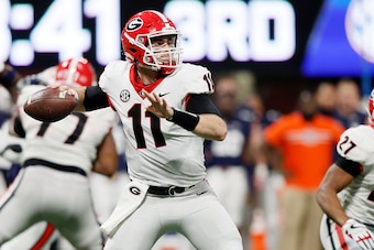 ATLANTA, GA - DECEMBER 02: Jake Fromm #11 of the Georgia Bulldogs throws a pass during the second half against the Auburn Tigers in the SEC Championship at Mercedes-Benz Stadium on December 2, 2017 in Atlanta, Georgia. (Photo by Jamie Squire/Getty Images)