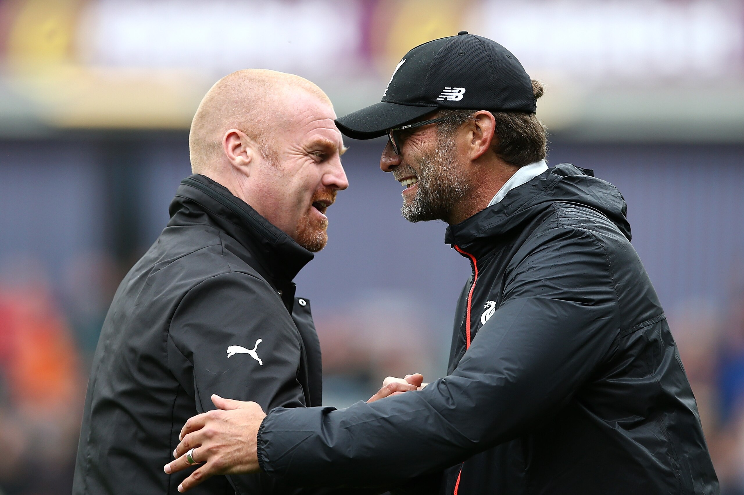 BURNLEY, ENGLAND - AUGUST 20:  Manager of Liverpool Jurgen Klopp and Sean Dyche, Manager of Burnley embrace ahead of kick off during the Premier League match between Burnley and Liverpool at Turf Moor on August 20, 2016 in Burnley, England.  (Photo by Jan