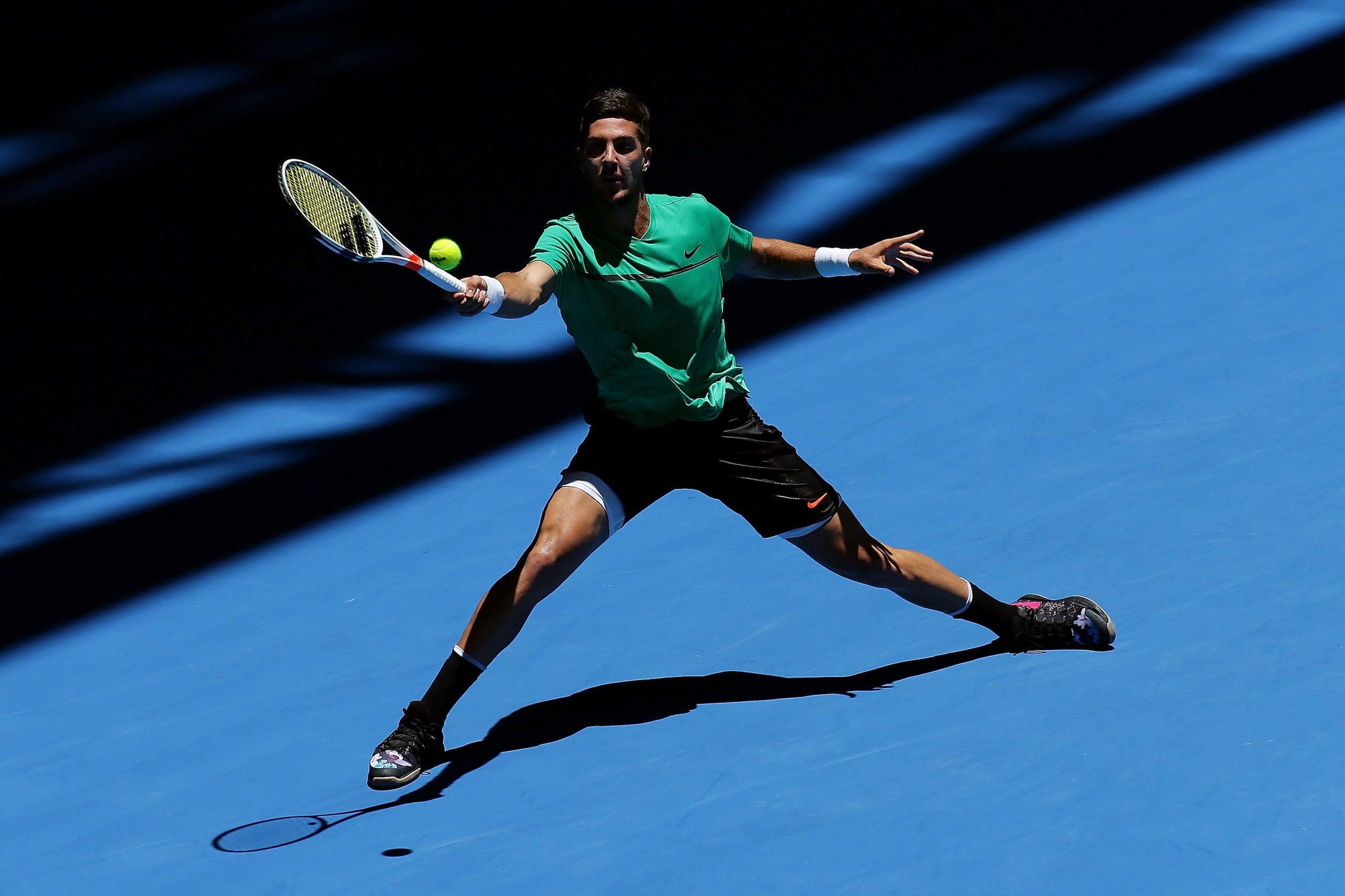 PERTH, AUSTRALIA - DECEMBER 31: Thanasi Kokkinakis of Australia stretches to play a forehand to Vasek Pospisil of Canada serves in the mens singles match on day two of the 2018 Hopman Cup at Perth Arena on December 31, 2017 in Perth, Australia. (Photo by PERTH, AUSTRALIA - DECEMBER 31: Thanasi Kokkinakis of Australia stretches to play a forehand to Vasek Pospisil of Canada serves in the mens singles match on day two of the 2018 Hopman Cup at Perth Arena on December 31, 2017 in Perth, Australia. (Photo by