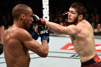 LAS VEGAS, NV - DECEMBER 30:  (R-L) Khabib Nurmagomedov of Russia punches Edson Barboza of Brazil in their lightweight bout during the UFC 219 event inside T-Mobile Arena on December 30, 2017 in Las Vegas, Nevada. (Photo by Jeff Bottari/Zuffa LLC/Zuffa LL