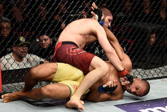 LAS VEGAS, NV - DECEMBER 30:  (L-R) Khabib Nurmagomedov of Russia punches Edson Barboza of Brazil in their lightweight bout during the UFC 219 event inside T-Mobile Arena on December 30, 2017 in Las Vegas, Nevada. (Photo by Jeff Bottari/Zuffa LLC/Zuffa LL