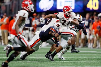 ATLANTA, GA - DECEMBER 02: Nick Chubb #27 of the Georgia Bulldogs runs the ball during the second half against the Auburn Tigers in the SEC Championship at Mercedes-Benz Stadium on December 2, 2017 in Atlanta, Georgia. (Photo by Jamie Squire/Getty Images)