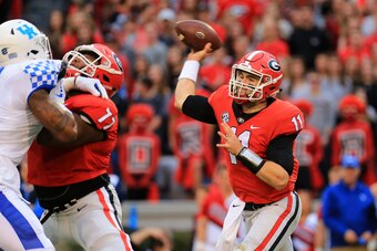 ATHENS, GA - NOVEMBER 18: Jake Fromm #11 of the Georgia Bulldogs throws a pass during the first half against the Kentucky Wildcats at Sanford Stadium on November 18, 2017 in Athens, Georgia. (Photo by Daniel Shirey/Getty Images)