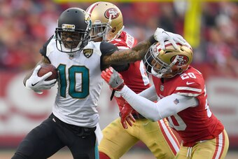 SANTA CLARA, CA - DECEMBER 24:  Jaelen Strong #10 of the Jacksonville Jaguars attempts to fight off the tackle of Don Jones #20 of the San Francisco 49ers during their NFL football game at Levi's Stadium on December 24, 2017 in Santa Clara, California.  (