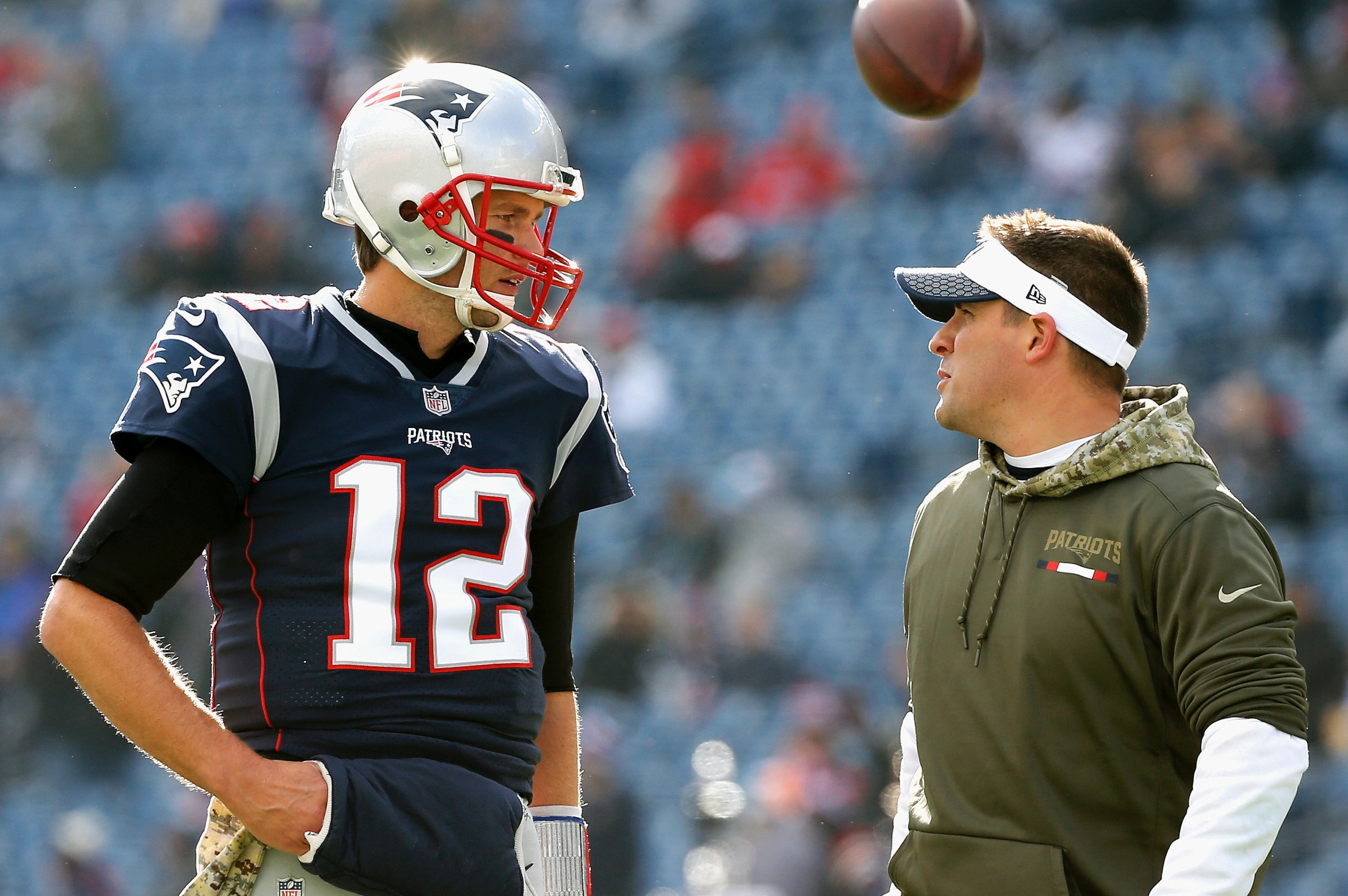 FOXBORO, MA - NOVEMBER 26:  Tom Brady #12  of the New England Patriots reacts with offensive coordinator Josh McDaniels before a game against the Miami Dolphins at Gillette Stadium on November 26, 2017 in Foxboro, Massachusetts.  (Photo by Jim Rogash/Gett