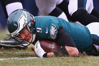 PHILADELPHIA, PA - DECEMBER 31:  Quarterback Nick Foles #9 of the Philadelphia Eagles recovers his own fumble against the Dallas Cowboys during the first quarter of the game at Lincoln Financial Field on December 31, 2017 in Philadelphia, Pennsylvania.  (