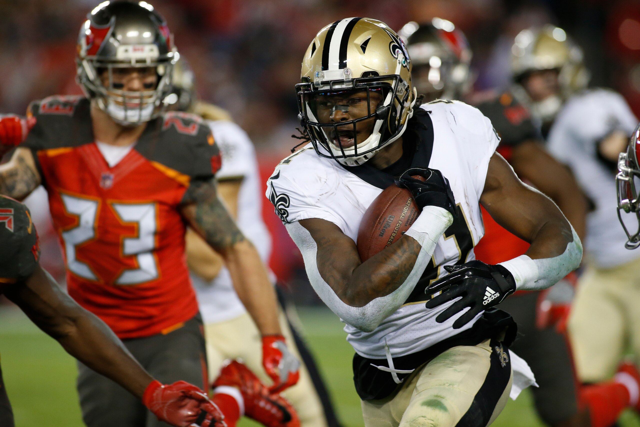 TAMPA, FL - DECEMBER 31:  Running back Alvin Kamara #41 of the New Orleans Saints runs for a first down during the fourth quarter of an NFL football game against the Tampa Bay Buccaneers on December 31, 2017 at Raymond James Stadium in Tampa, Florida. (Ph