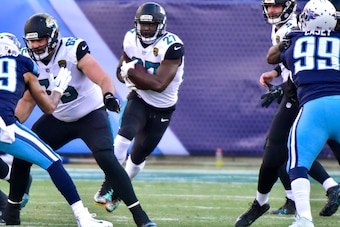 NASHVILLE, TN - DECEMBER 31: Running back Leonard Fournette #27 of the Jacksonville Jaguars carries the ball against the Tennessee Titans at Nissan Stadium on December 31, 2017 in Nashville, Tennessee. (Photo by Frederick Breedon/Getty Images)