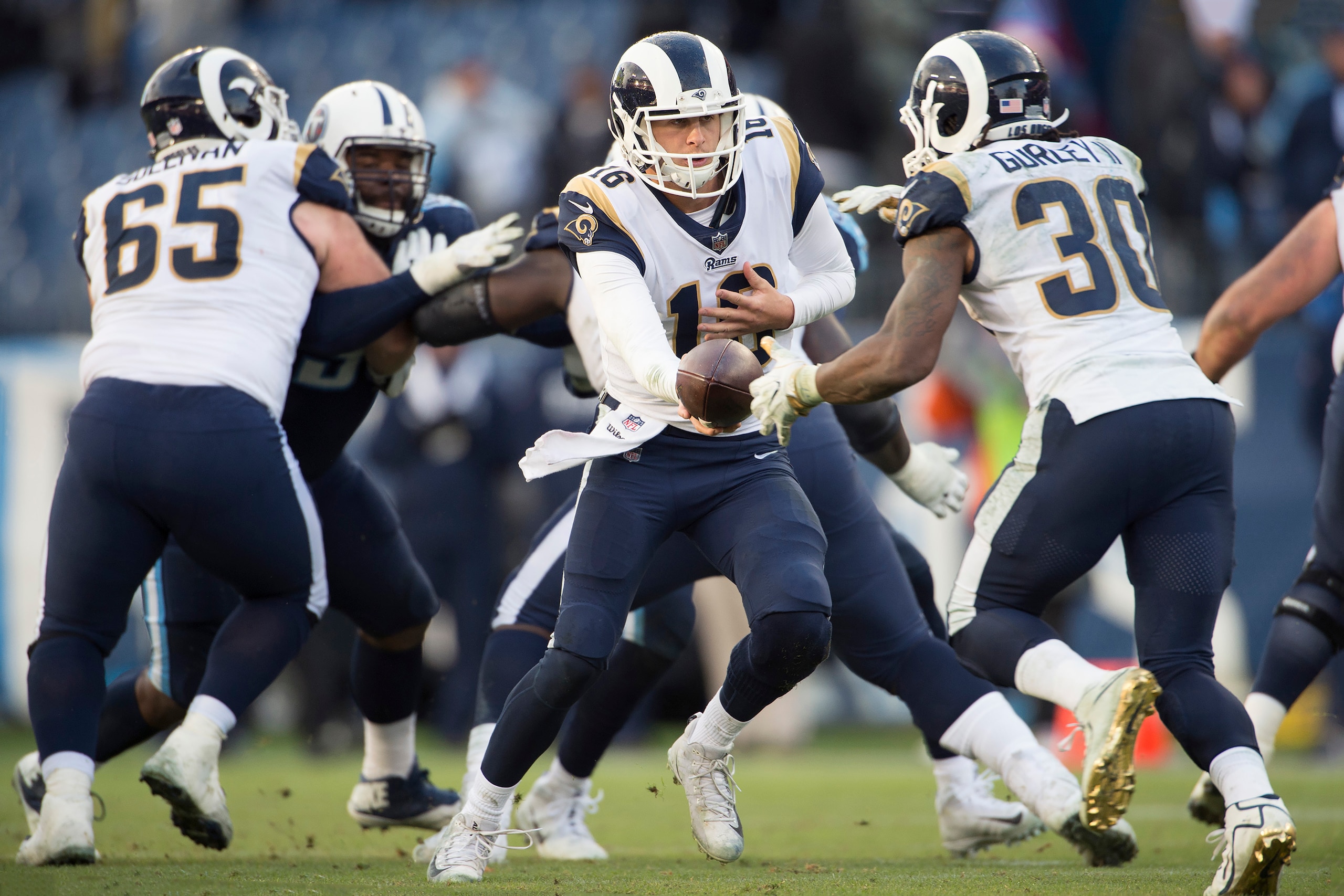 NASHVILLE, TN - DECEMBER 24: Quarterback Jared Goff #16 of the Los Angeles Rams hands off to running back Todd Gurley II #30 during a NFL game against the Tennessee Titans at Nissan Stadium on December 24, 2017 in Nashville, Tennessee. (Photo by Ronald NASHVILLE, TN - DECEMBER 24: Quarterback Jared Goff #16 of the Los Angeles Rams hands off to running back Todd Gurley II #30 during a NFL game against the Tennessee Titans at Nissan Stadium on December 24, 2017 in Nashville, Tennessee. (Photo by Ronald