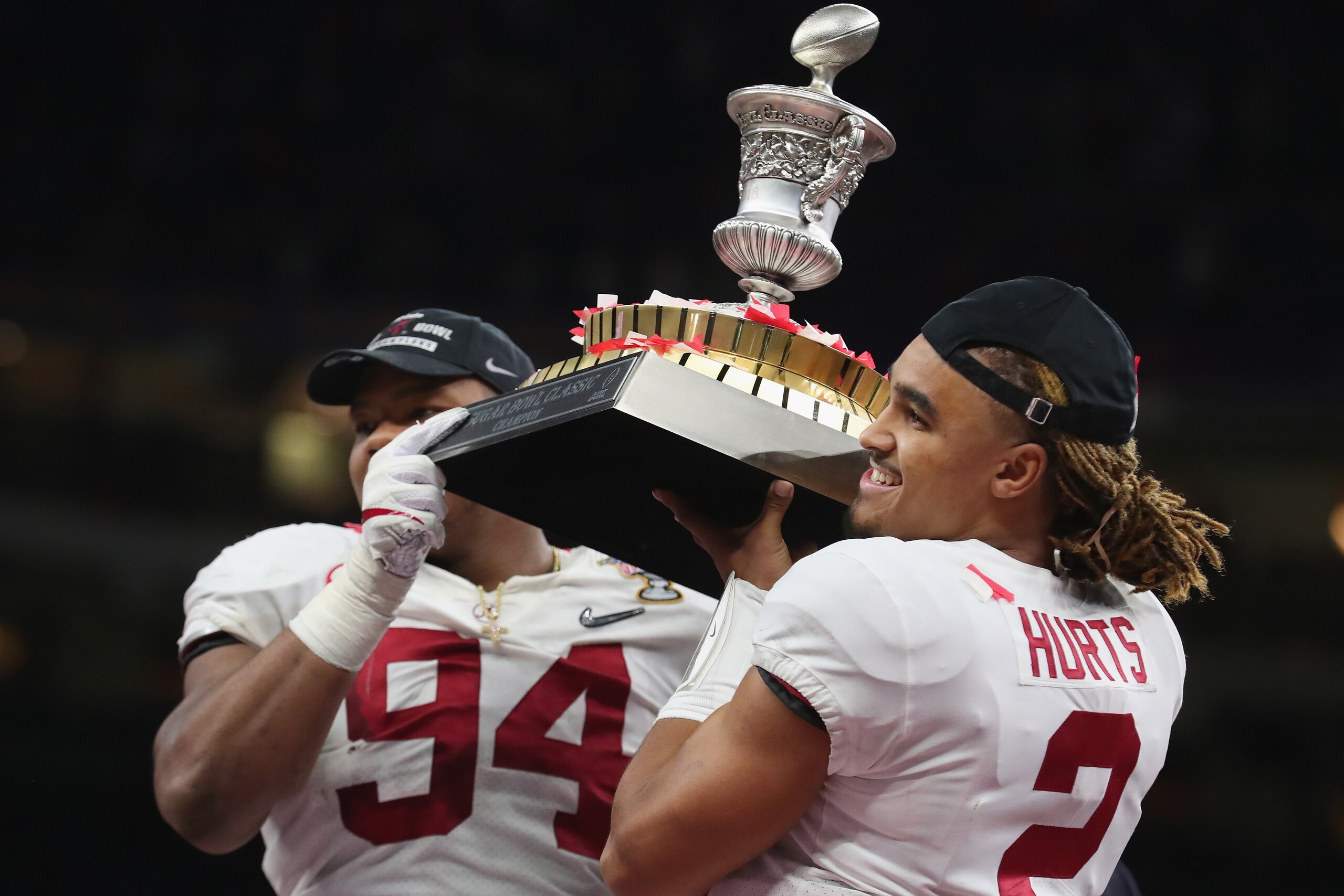 NEW ORLEANS, LA - JANUARY 01:  Jalen Hurts #2 of the Alabama Crimson Tide and Da'Ron Payne #94 celebrate with the trophy after the AllState Sugar Bowl against the Clemson Tigers at the Mercedes-Benz Superdome on January 1, 2018 in New Orleans, Louisiana. 
