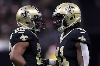 NEW ORLEANS, LA - DECEMBER 24:  Alvin Kamara #41 of the New Orleans Saints and  Mark Ingram #22 of the New Orleans Saints talk during the game against the Atlanta Falcons at Mercedes-Benz Superdome on December 24, 2017 in New Orleans, Louisiana.  (Photo b
