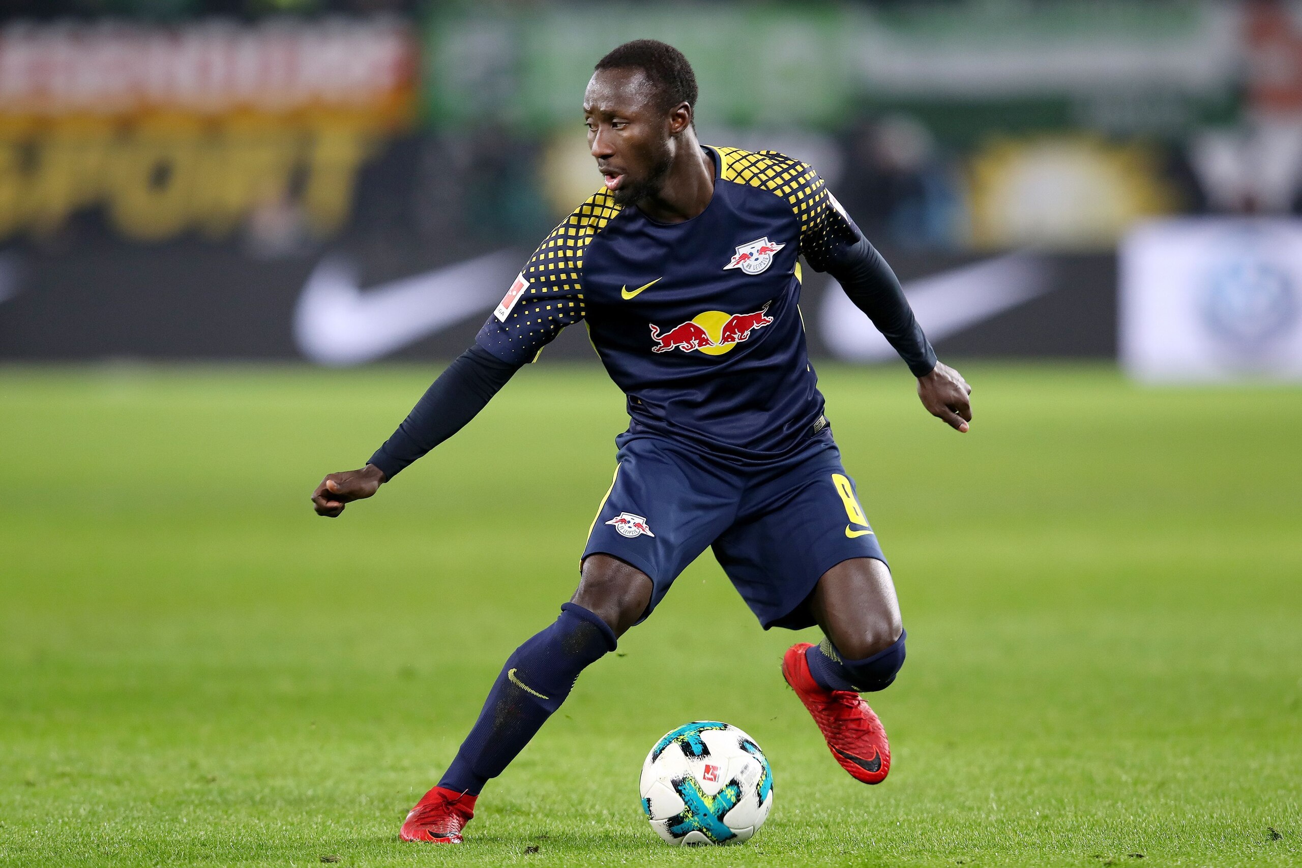 Leipzig's Guinean midfielder Naby Keita runs with the ball during the German first division Bundesliga football match between VfL Wolfsburg and RB Leipzig on December 12, 2017 in Wolfsburg.
 / AFP PHOTO / Ronny Hartmann / RESTRICTIONS: DURING MATCH TIME: 