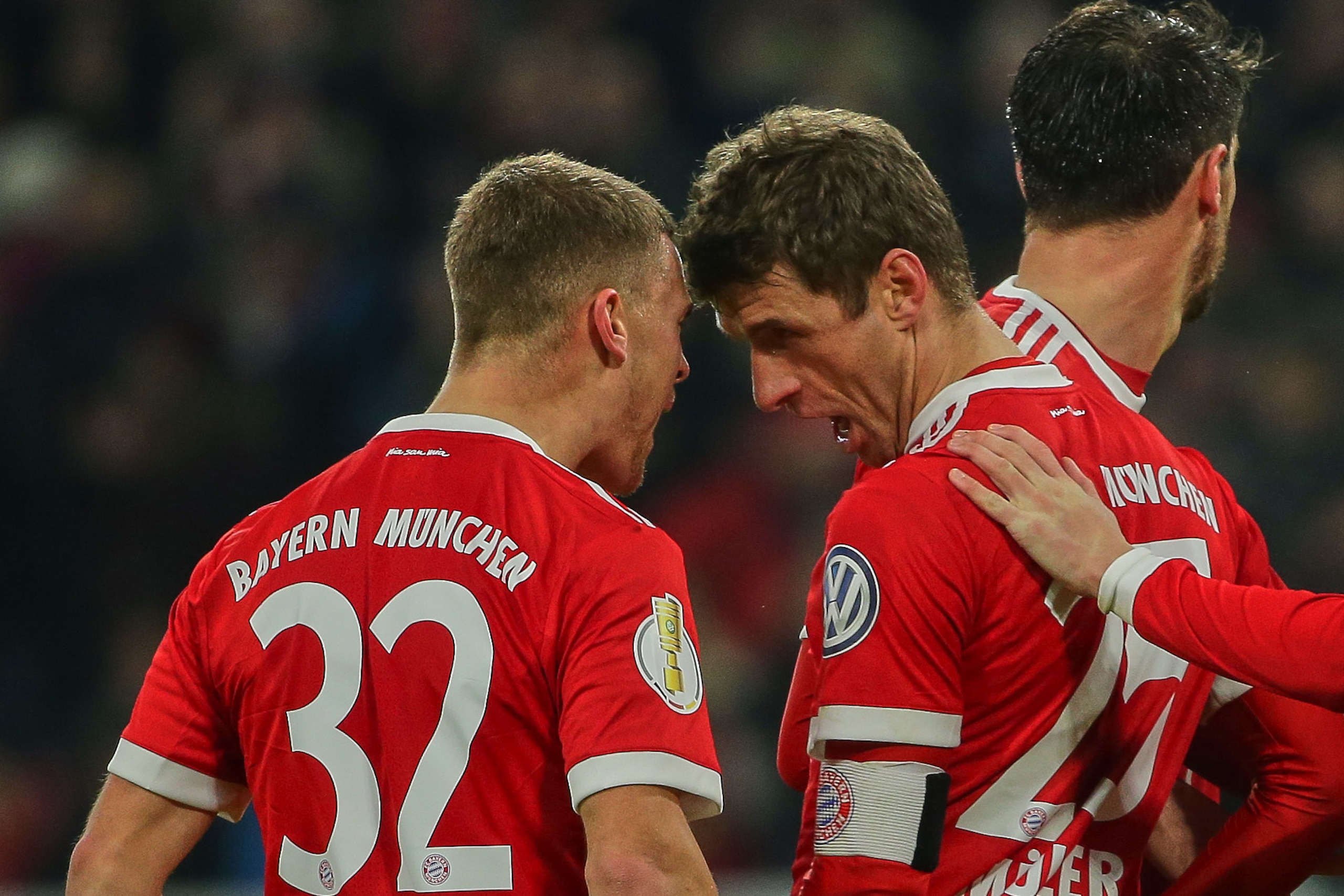MUNICH, GERMANY - DECEMBER 20: Thomas Mueller of Muenchen celebrates after scoring his team`s second goal with Joshua Kimmich of Muenchen during the DFB Cup match between Bayern Muenchen and Borussia Dortmund at Allianz Arena on December 20, 2017 in Munic