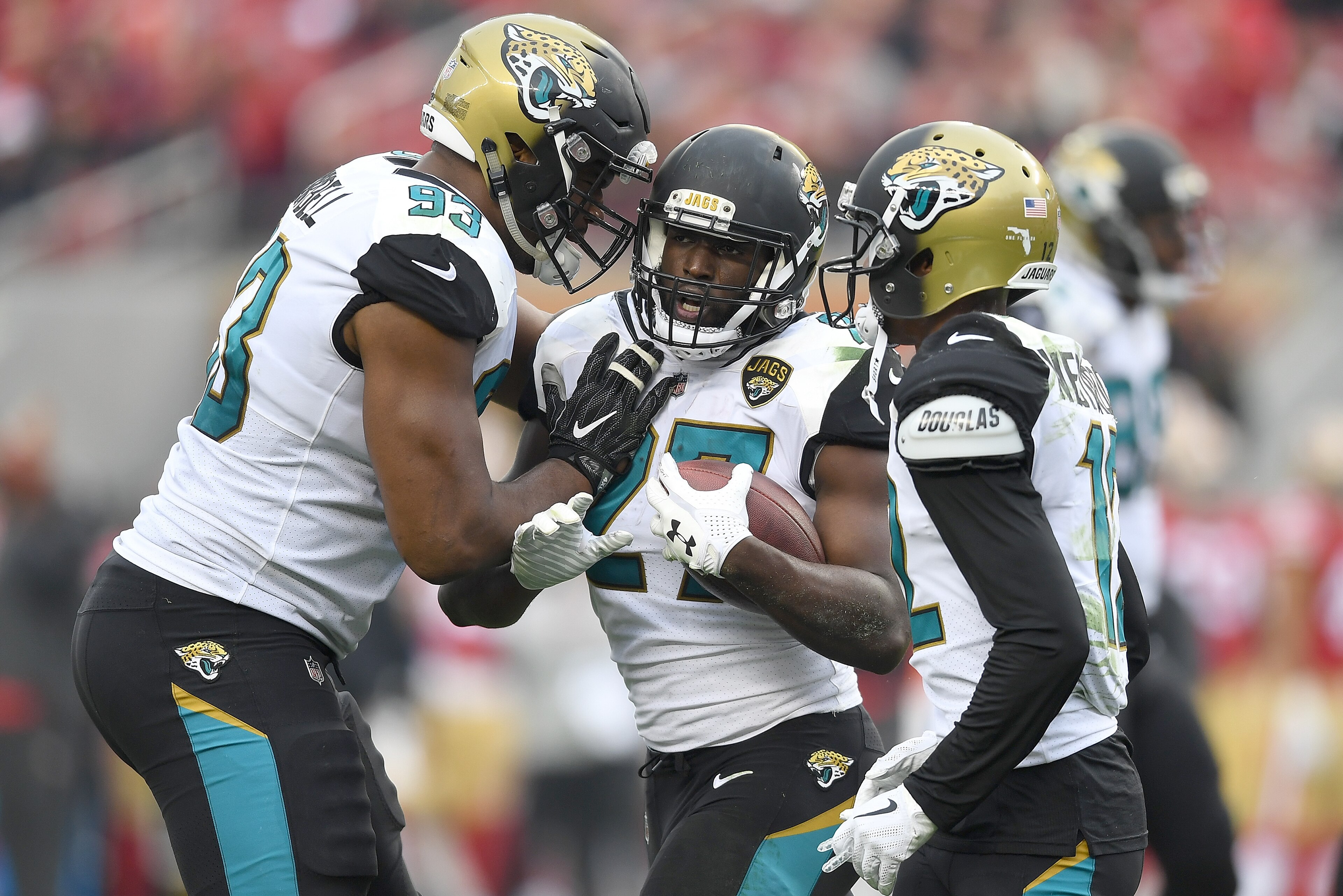 SANTA CLARA, CA - DECEMBER 24:  Leonard Fournette #27 of the Jacksonville Jaguars is congratulated by Calais Campbell #93 after Fournette scored a touchdown against the San Francisco 49ers during their NFL football game at Levi's Stadium on December 24, 2