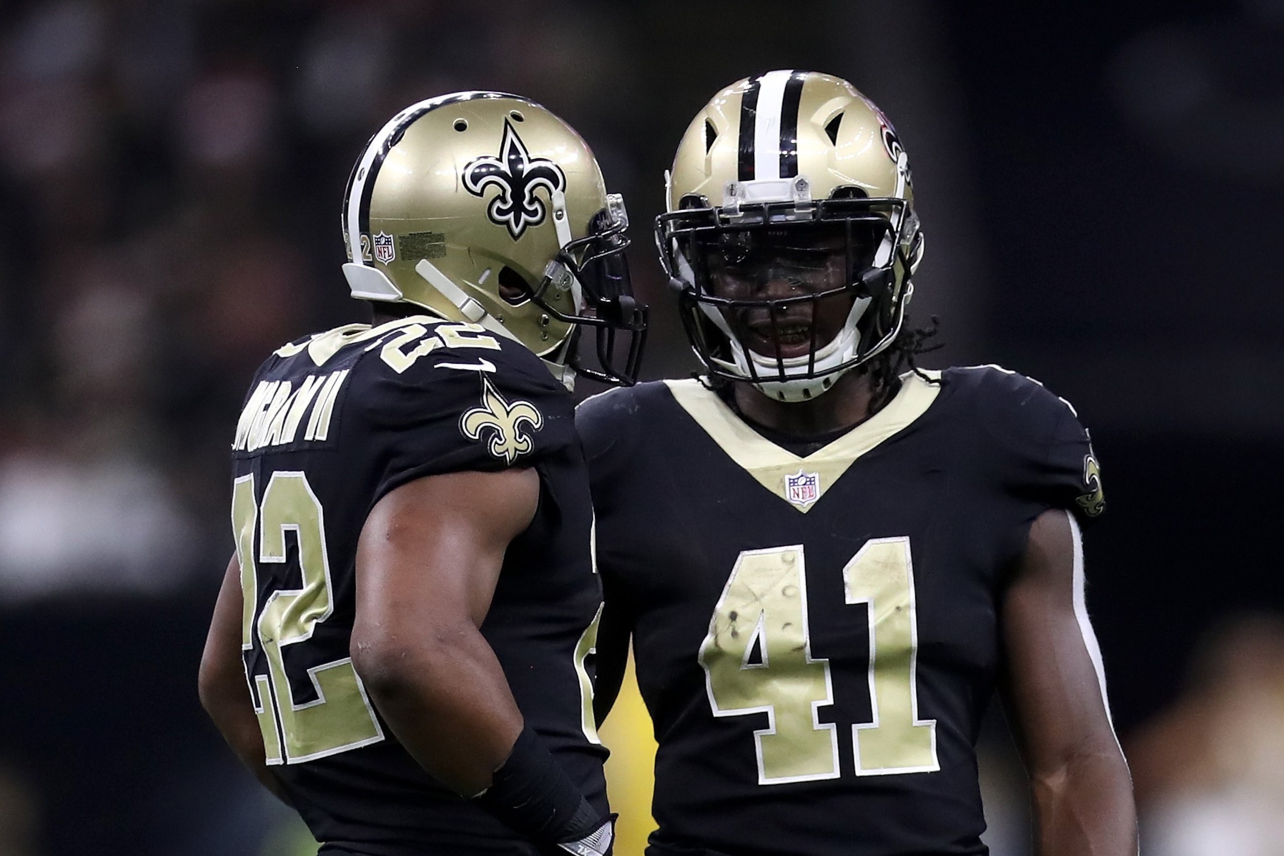 NEW ORLEANS, LA - DECEMBER 24:  Alvin Kamara #41 of the New Orleans Saints and  Mark Ingram #22 of the New Orleans Saints talk during the game against the Atlanta Falcons at Mercedes-Benz Superdome on December 24, 2017 in New Orleans, Louisiana.  (Photo b