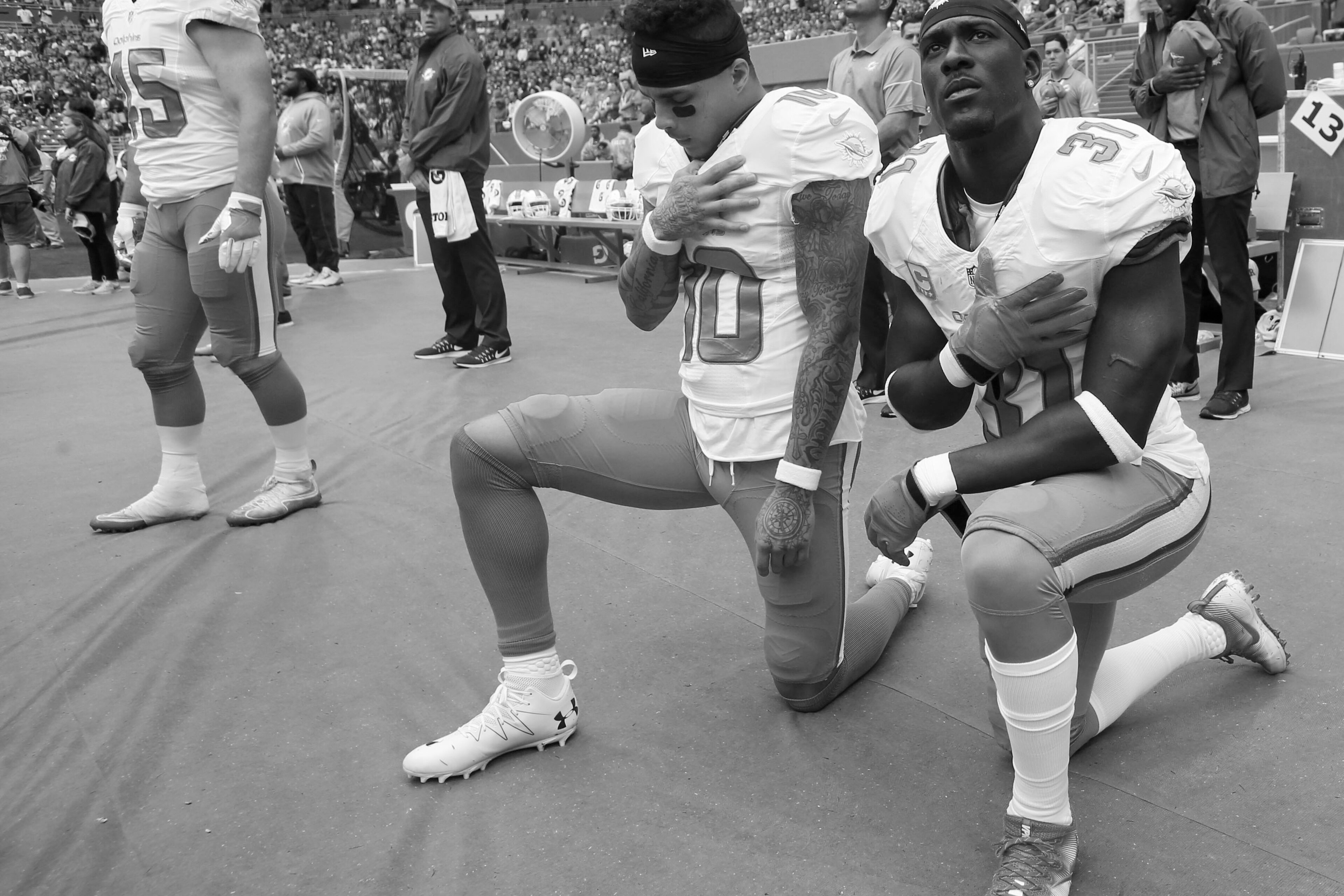 From left (kneeling): Kenny Stills and Michael Thomas From left (kneeling): Kenny Stills and Michael Thomas