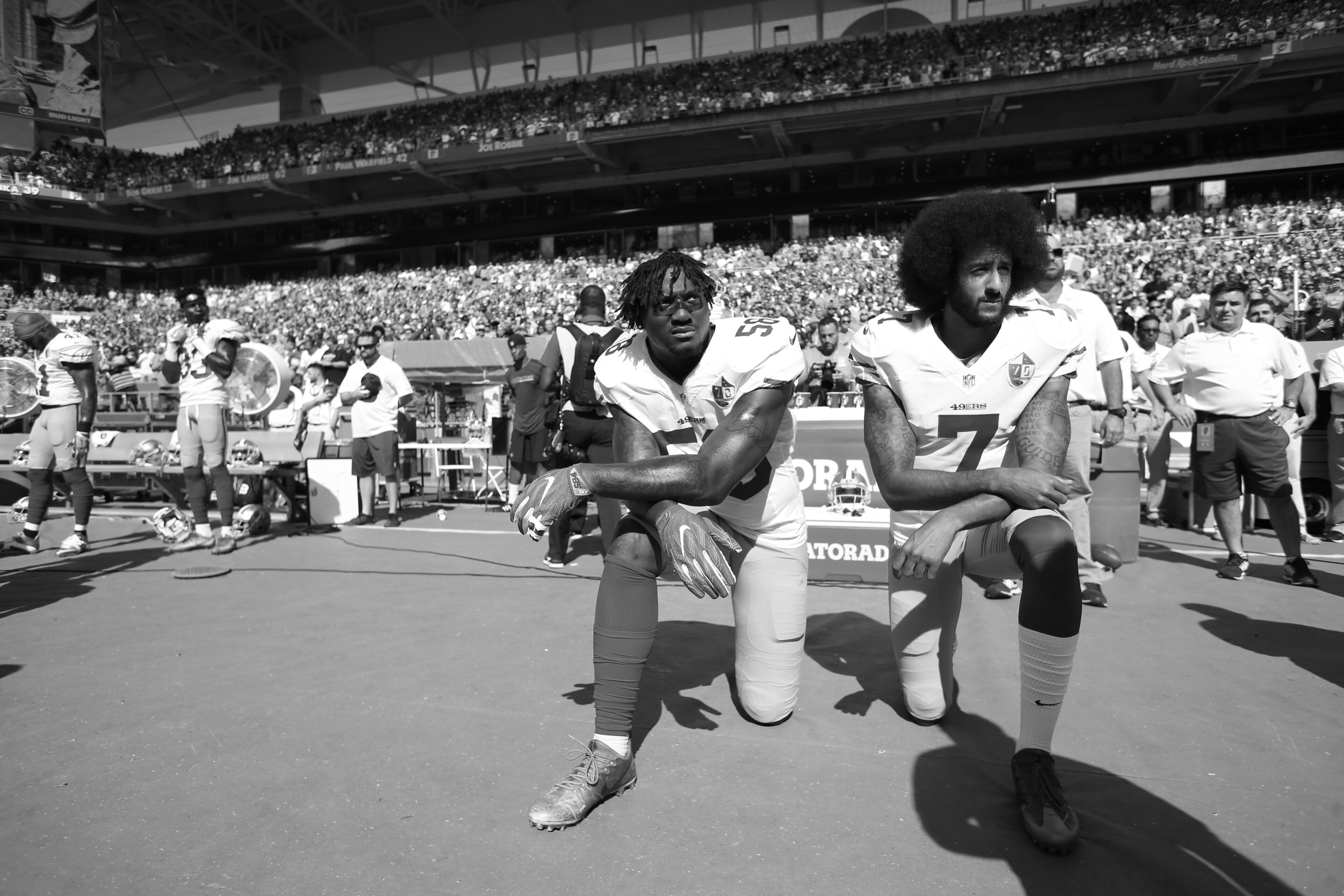 From left (kneeling): Eli Harold and Colin Kaepernick From left (kneeling): Eli Harold and Colin Kaepernick