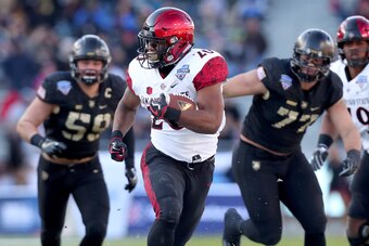 FORT WORTH, TX - DECEMBER 23:  Rashaad Penny #20 of the San Diego State Aztecs scores a touchdown against the Army Black Knights in the Lockheed Martin Armed Forces Bowl at Amon G. Carter Stadium on December 23, 2017 in Fort Worth, Texas.  (Photo by Tom P