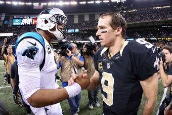 NEW ORLEANS, LA - DECEMBER 06:  Cam Newton #1 of the Carolina Panthers is congartulated by Drew Brees #9 of the New Orleans Saints after defeating the Saints 41-38 at the Mercedes-Benz Superdome on December 6, 2015 in New Orleans, Louisiana.  (Photo by Se