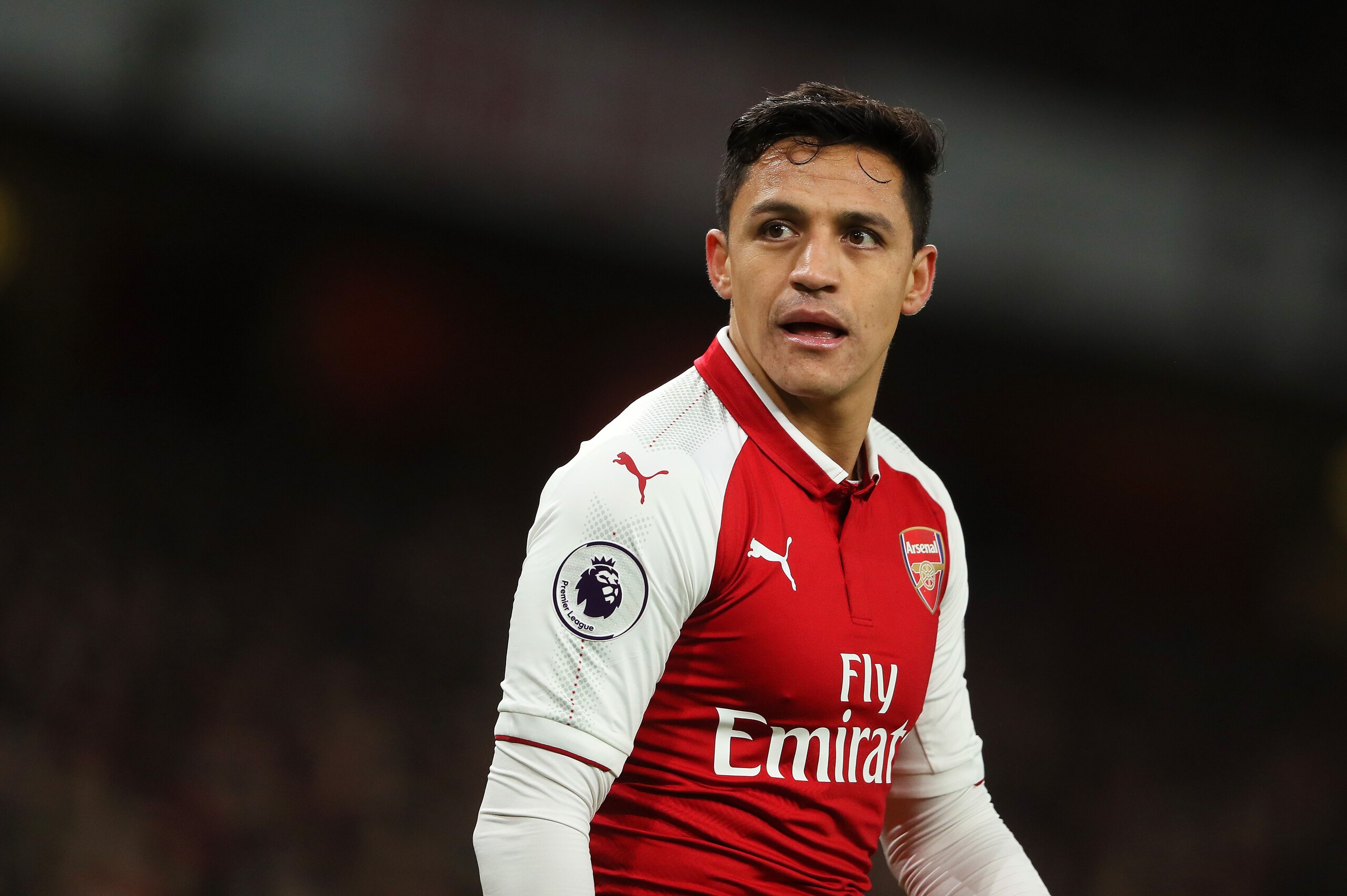 LONDON, ENGLAND - JANUARY 03:  Alexis Sanchez of Arsenal looks on during the Premier League match between Arsenal and Chelsea at Emirates Stadium on January 3, 2018 in London, England.  (Photo by Matthew Ashton - AMA/Getty Images)