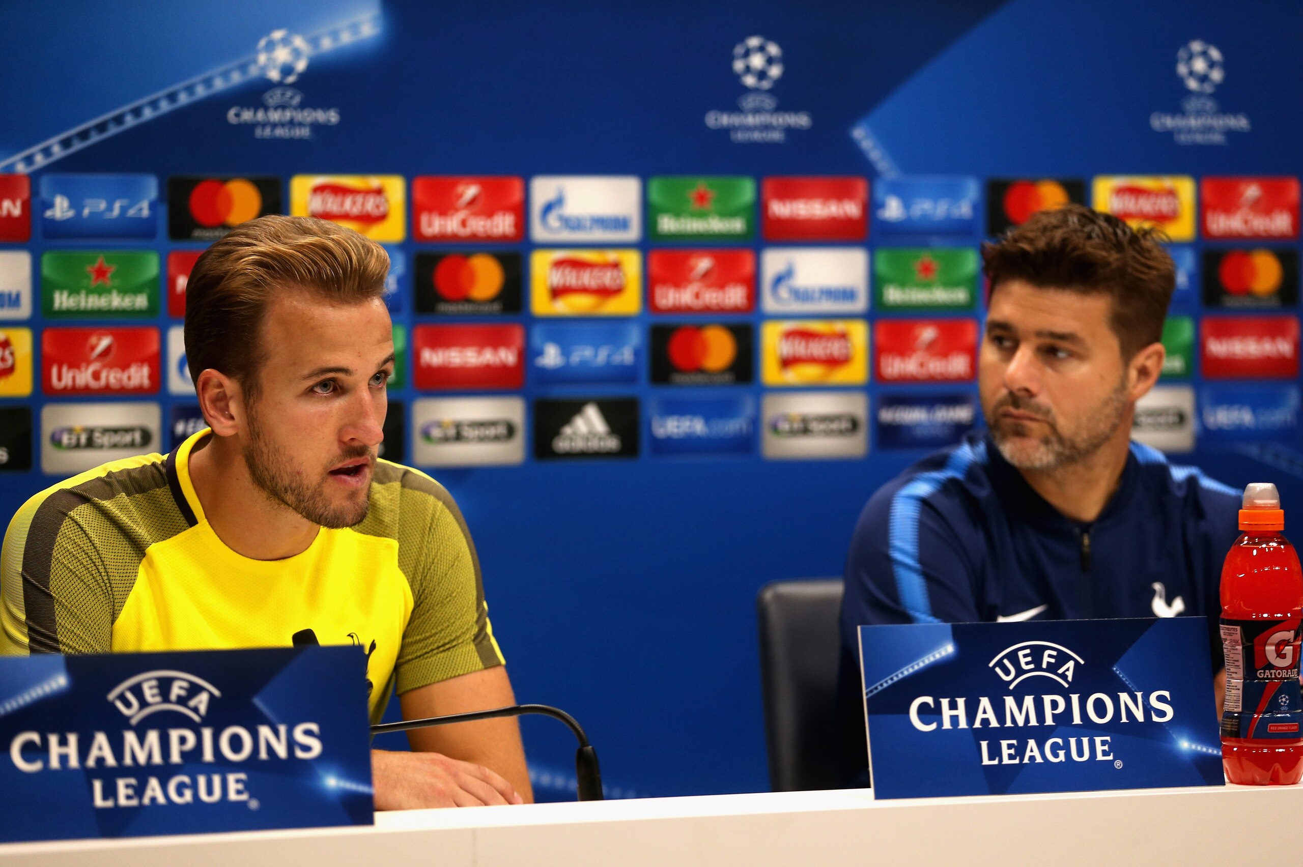 ENFIELD, ENGLAND - SEPTEMBER 12:  Mauricio Pochettino, Manager of Tottenham Hotspur (R) looks on as Harry Kane of Tottenham Hotspur speaks during a Tottenham Hotspur press conference ahead of their UEFA Champions League Group H match against Borussia Dort