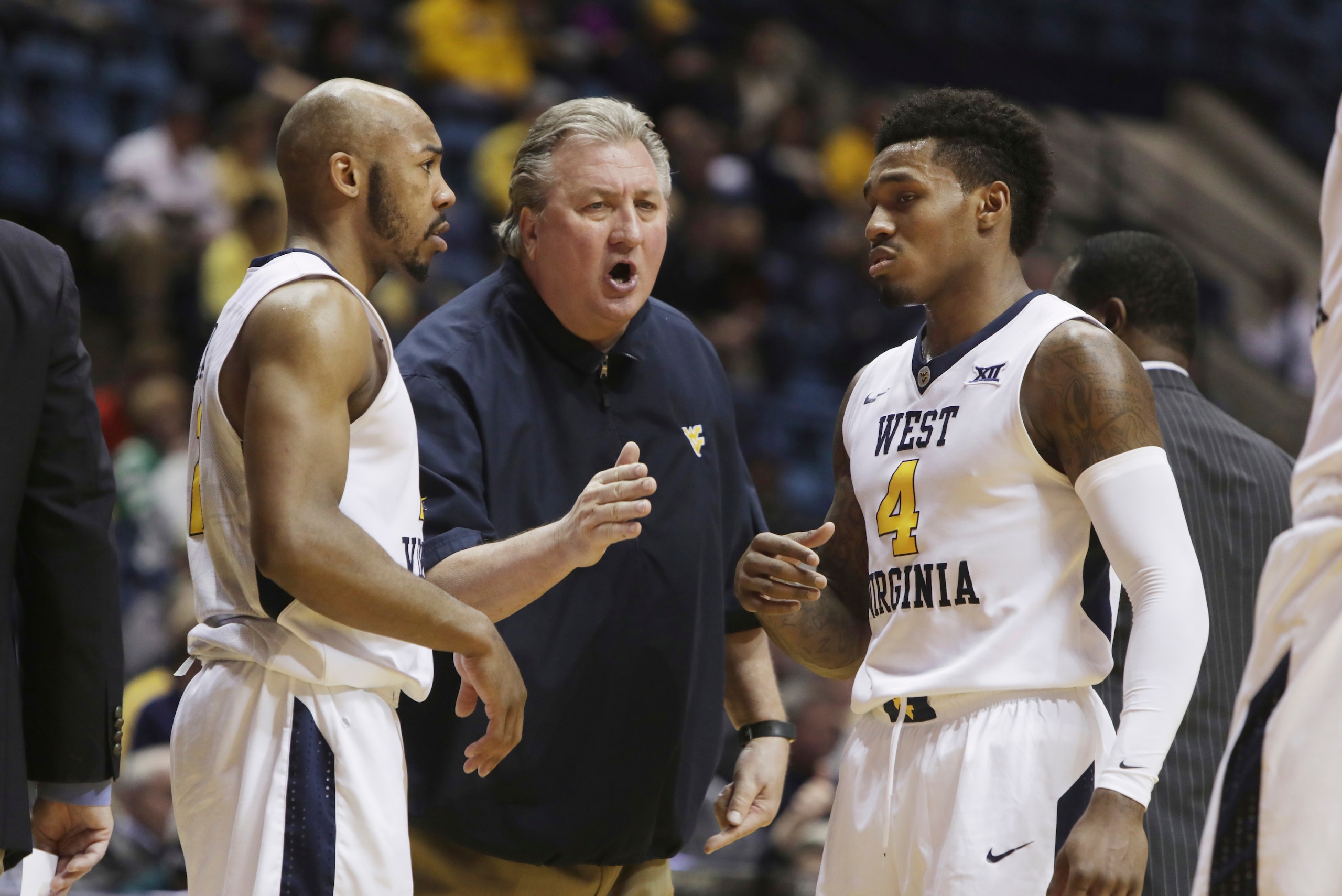 Jevon Carter, Bob Huggins and Daxter Miles Jr. Jevon Carter, Bob Huggins and Daxter Miles Jr.