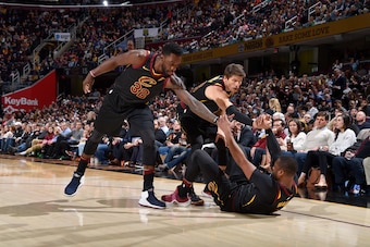 CLEVELAND, OH - DECEMBER 6:  Jeff Green #32 of the Cleveland Cavaliers and Kyle Korver #26 of the Cleveland Cavaliers help Dwyane Wade #9 of the Cleveland Cavaliers up after a fall during the game against the Sacramento Kings on December 6, 2017 at Quicke