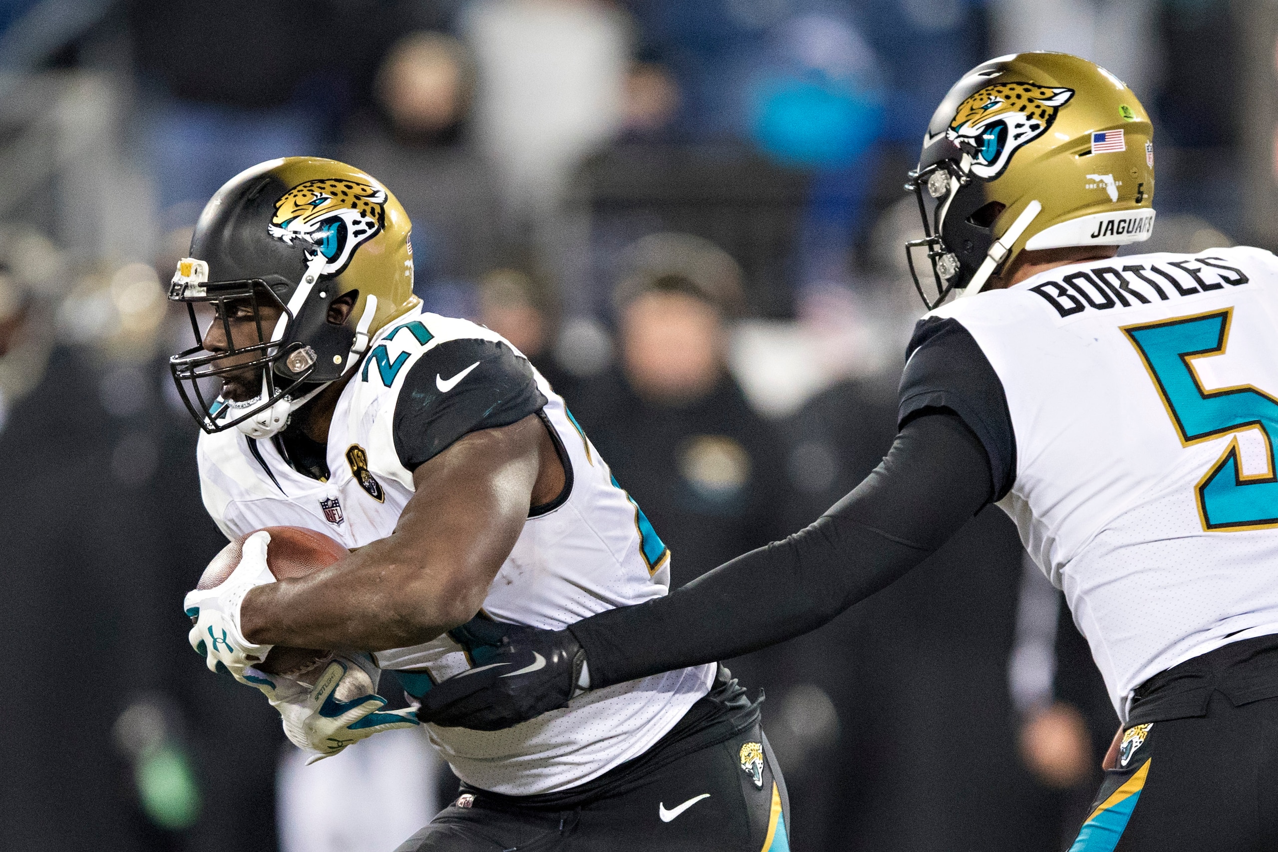 NASHVILLE, TN - DECEMBER 31:  Blake Bortles #5 hands off the ball to Leonard Fournette #27 of the Jacksonville Jaguars during a game against the Tennessee Titans at Nissan Stadium on December 31, 2017 in Nashville, Tennessee.  The Titans defeated the Jagu