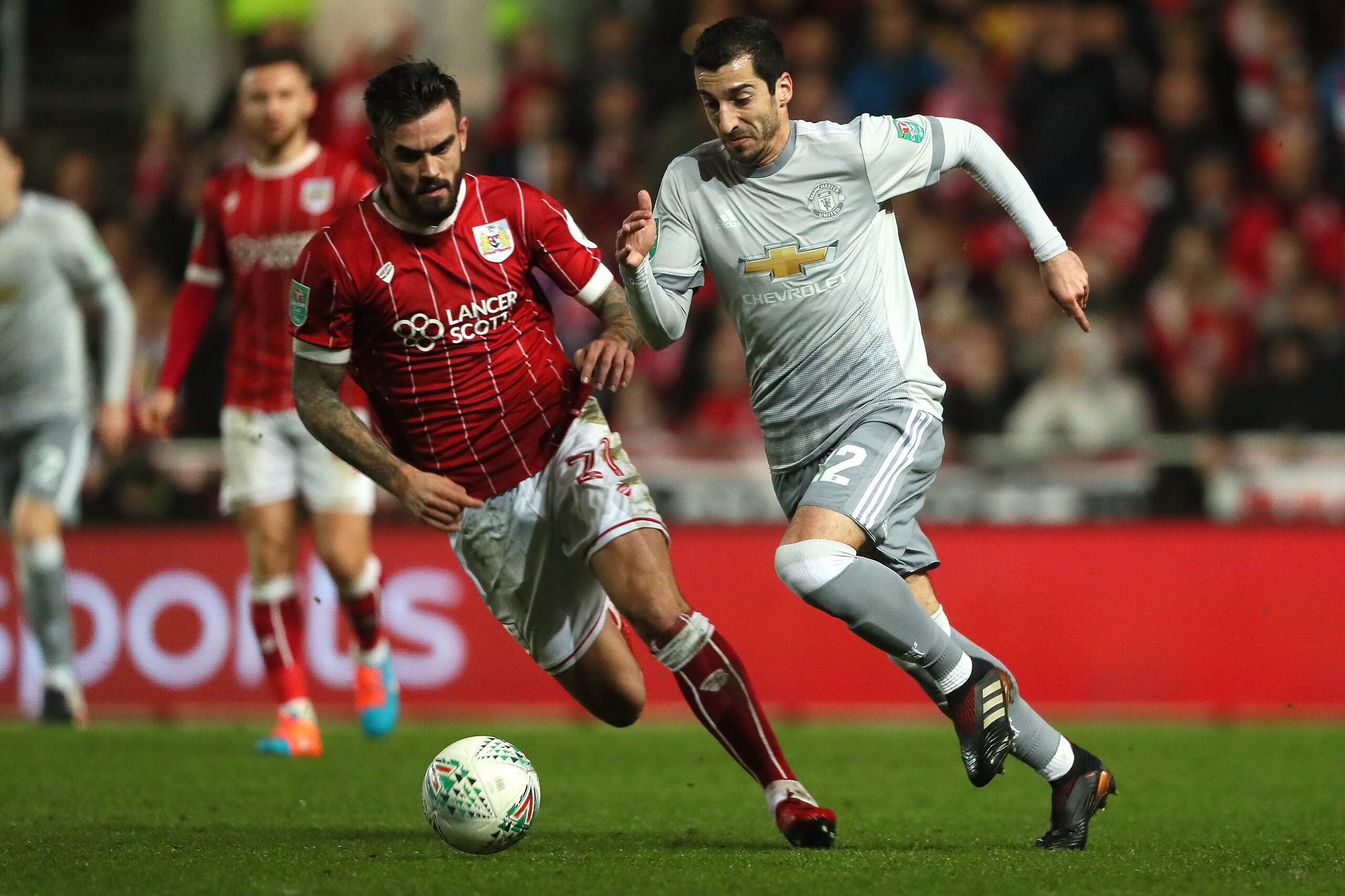 BRISTOL, ENGLAND - DECEMBER 20:   Henrikh Mkhitaryan of Manchester United competes with Marlon Pack of Bristol City during the Carabao Cup Quarter-Final match between Bristol City and Manchester United at Ashton Gate on December 20, 2017 in Bristol, Engla