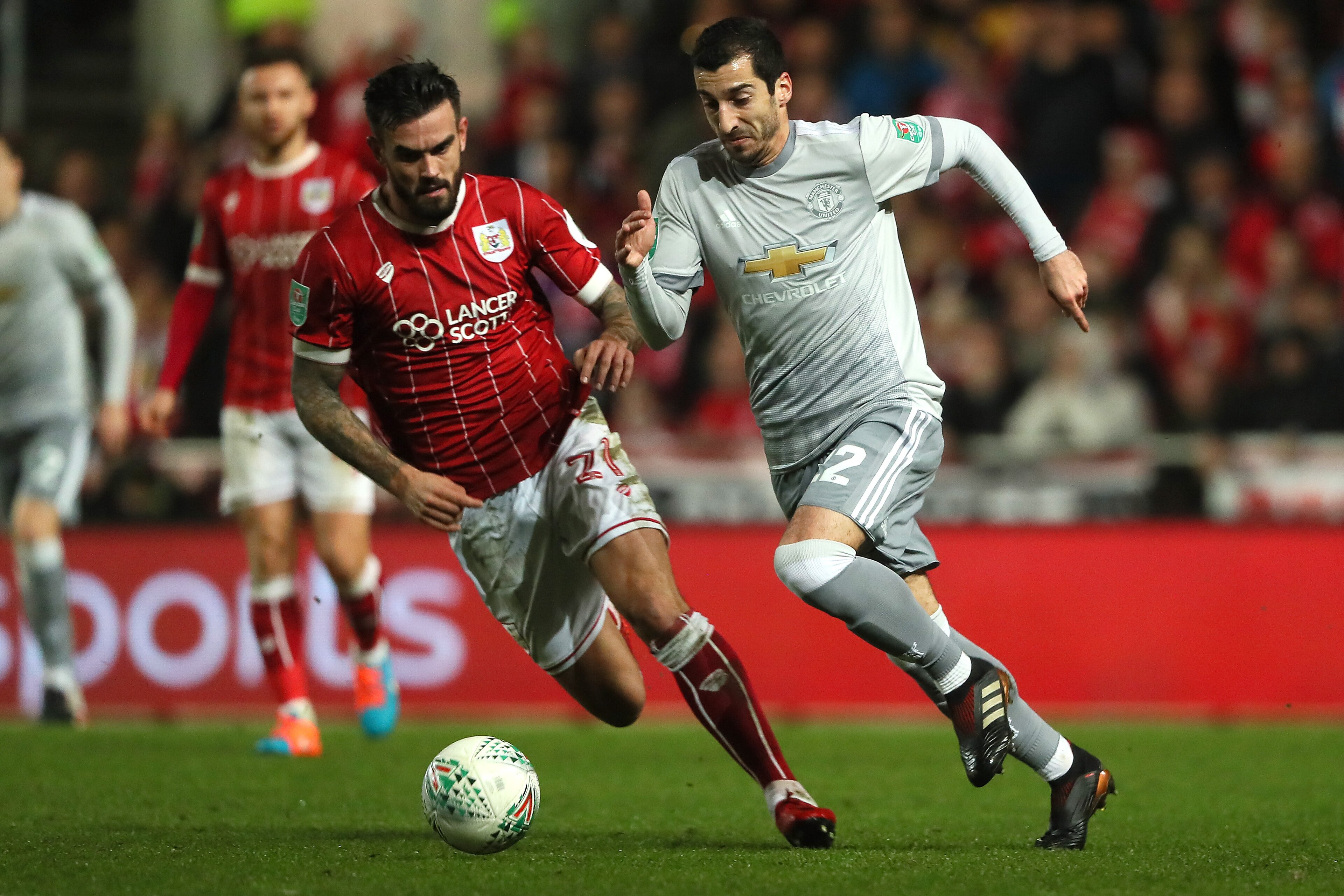 BRISTOL, ENGLAND - DECEMBER 20:   Henrikh Mkhitaryan of Manchester United competes with Marlon Pack of Bristol City during the Carabao Cup Quarter-Final match between Bristol City and Manchester United at Ashton Gate on December 20, 2017 in Bristol, Engla
