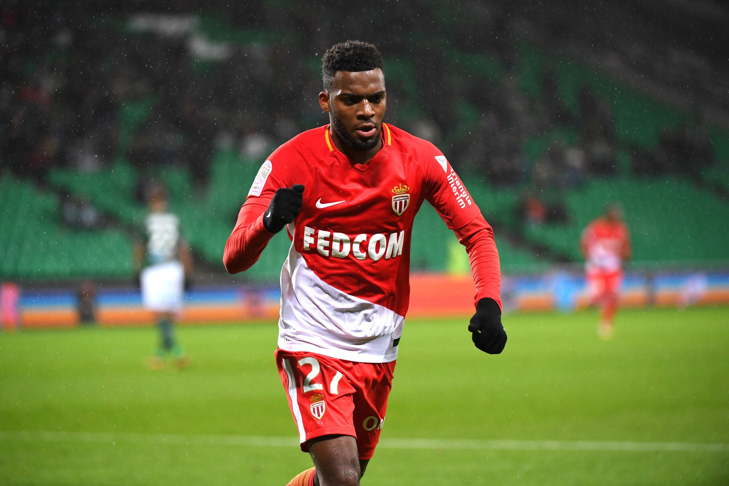 Monacos French midfielder Thomas Lemar (C) celebrates after scoring a goal during the French L1 football match between Saint-Etienne (ASSE) and Monaco (ASM) on December 15, 2017, at the Geoffroy Guichard stadium in Saint-Etienne, central-eastern France.  