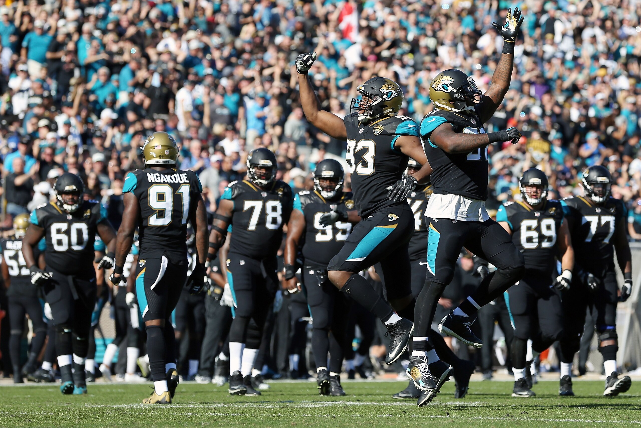 JACKSONVILLE, FL - DECEMBER 17:  Calais Campbell #93 and  Malik Jackson #97 of the Jacksonville Jaguars celebrate a play during the second half of their game against the Houston Texans at EverBank Field on December 17, 2017 in Jacksonville, Florida.  (Pho