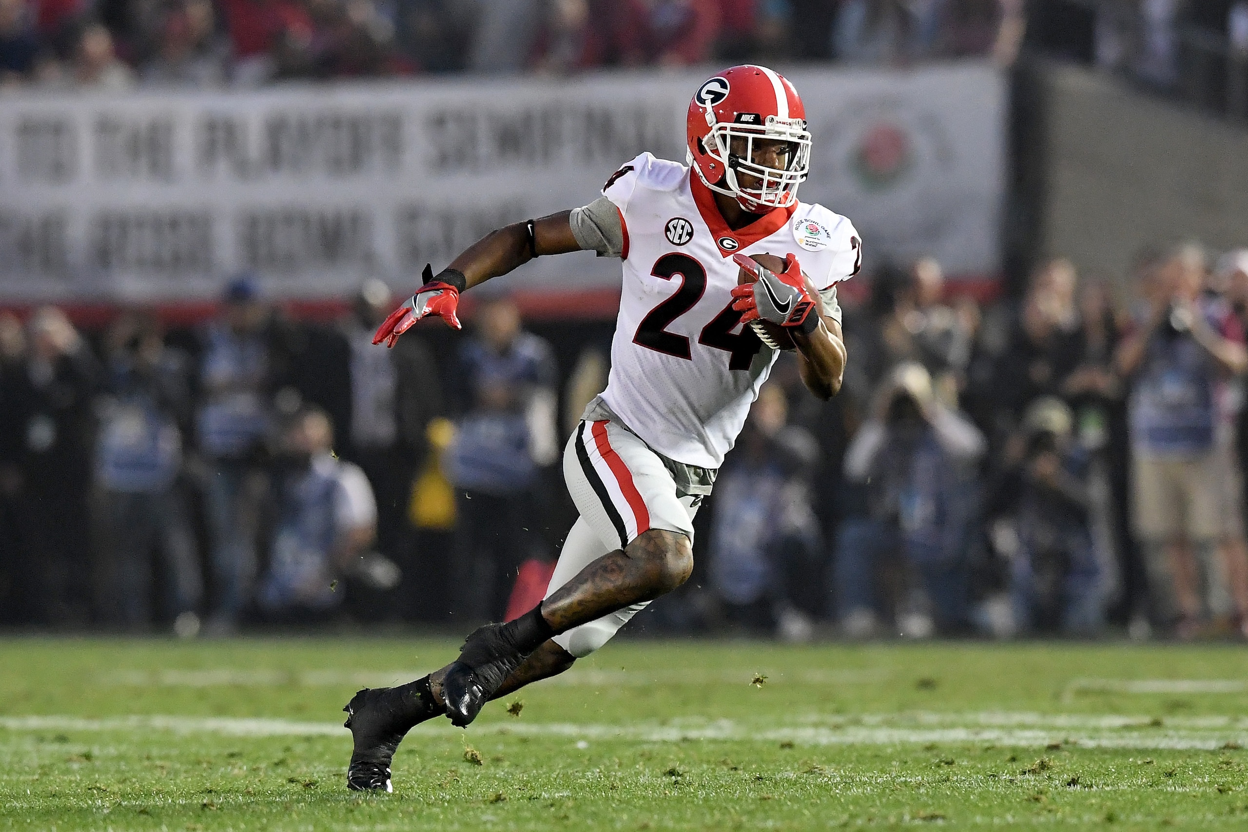 PASADENA, CA - JANUARY 01:  Safety Dominick Sanders #24 of the Georgia Bulldogs runs with the ball for 39-yards after an interception in the second half against the Oklahoma Sooners in the 2018 College Football Playoff Semifinal at the Rose Bowl Game pres