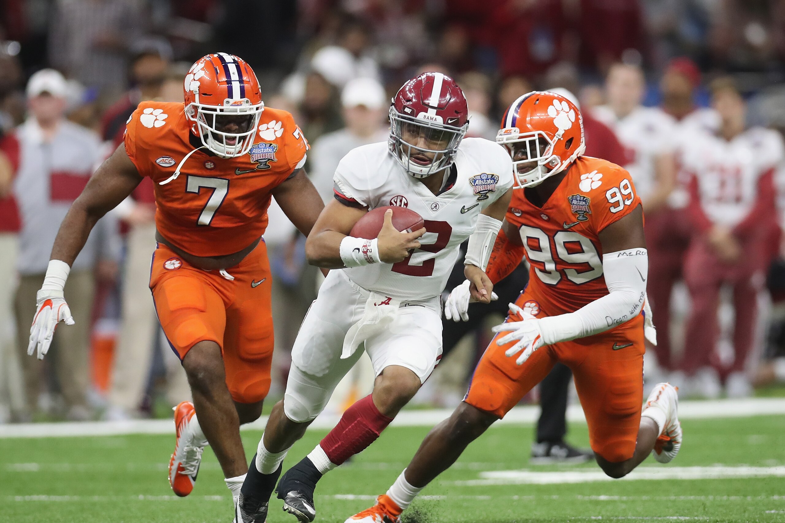 NEW ORLEANS, LA - JANUARY 01: Jalen Hurts #2 of the Alabama Crimson Tide runs with the ball as Clelin Ferrell #99 of the Clemson Tigers and Austin Bryant #7 defend in the first half of the AllState Sugar Bowl at the Mercedes-Benz Superdome on January 1, NEW ORLEANS, LA - JANUARY 01: Jalen Hurts #2 of the Alabama Crimson Tide runs with the ball as Clelin Ferrell #99 of the Clemson Tigers and Austin Bryant #7 defend in the first half of the AllState Sugar Bowl at the Mercedes-Benz Superdome on January 1,
