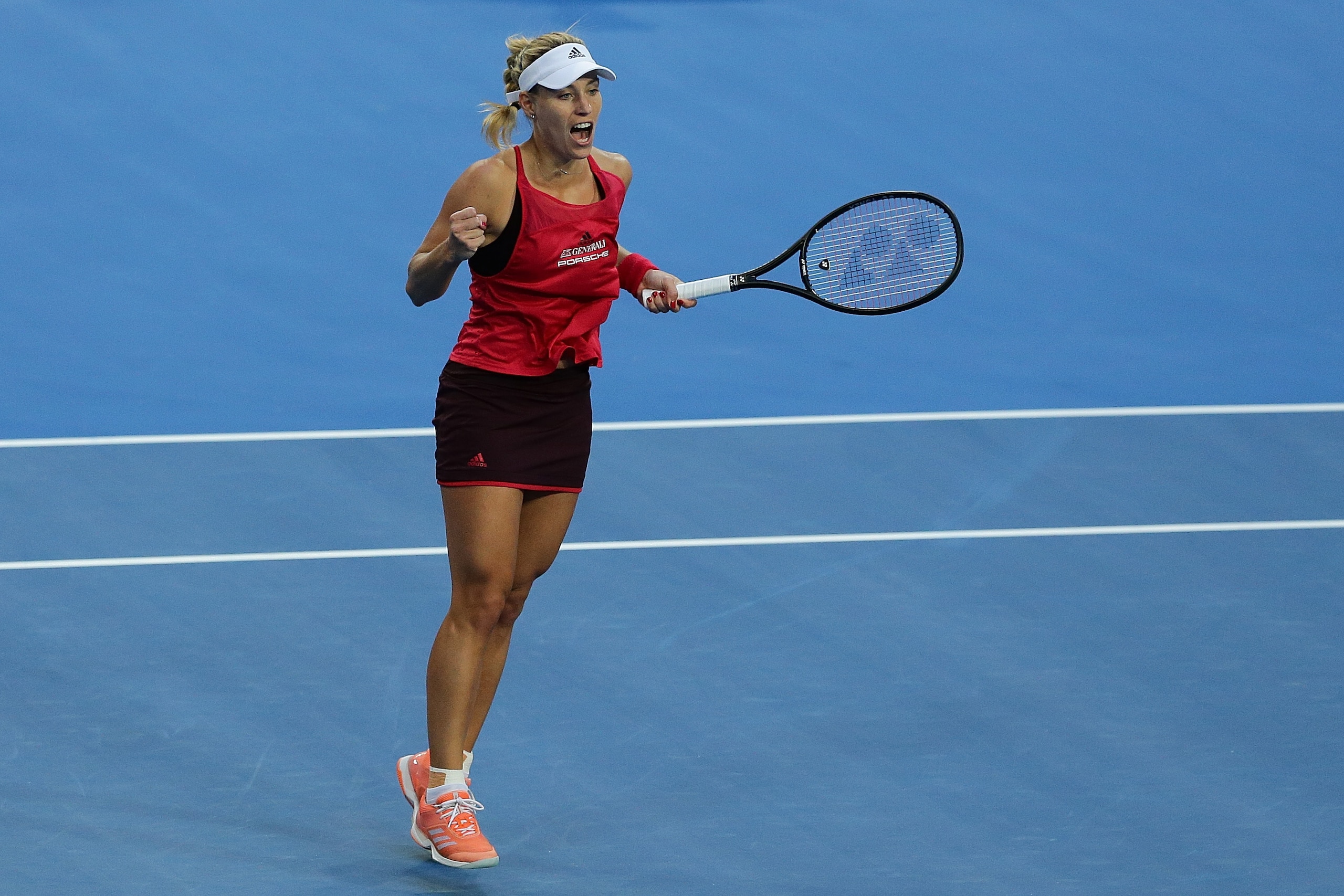 PERTH, AUSTRALIA - JANUARY 06:  Angelique Kerber of Germany celebrates a point to Belinda Bencic of Switzerland in the womens singles match on Day Seven of the  2018 Hopman Cup  at Perth Arena on January 6, 2018 in Perth, Australia.  (Photo by Will Russel